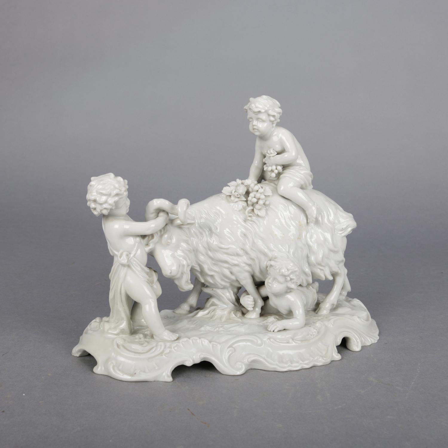 An antique Italian Capodimonte figural Blanc de Chine grouping depicts Classical farm scene of playful cherubs or putti and a goat, crown 
