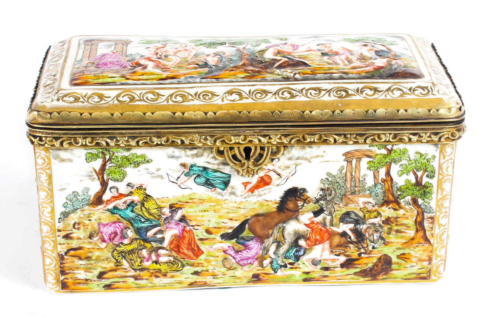 This is a beautiful antique Italian Capodimonte porcelain casket, late 19th century in date.

The box and cover are superbly decorated in relief with classical scenes, and there are decorative ormolu mounts to the lid and base. The interior is