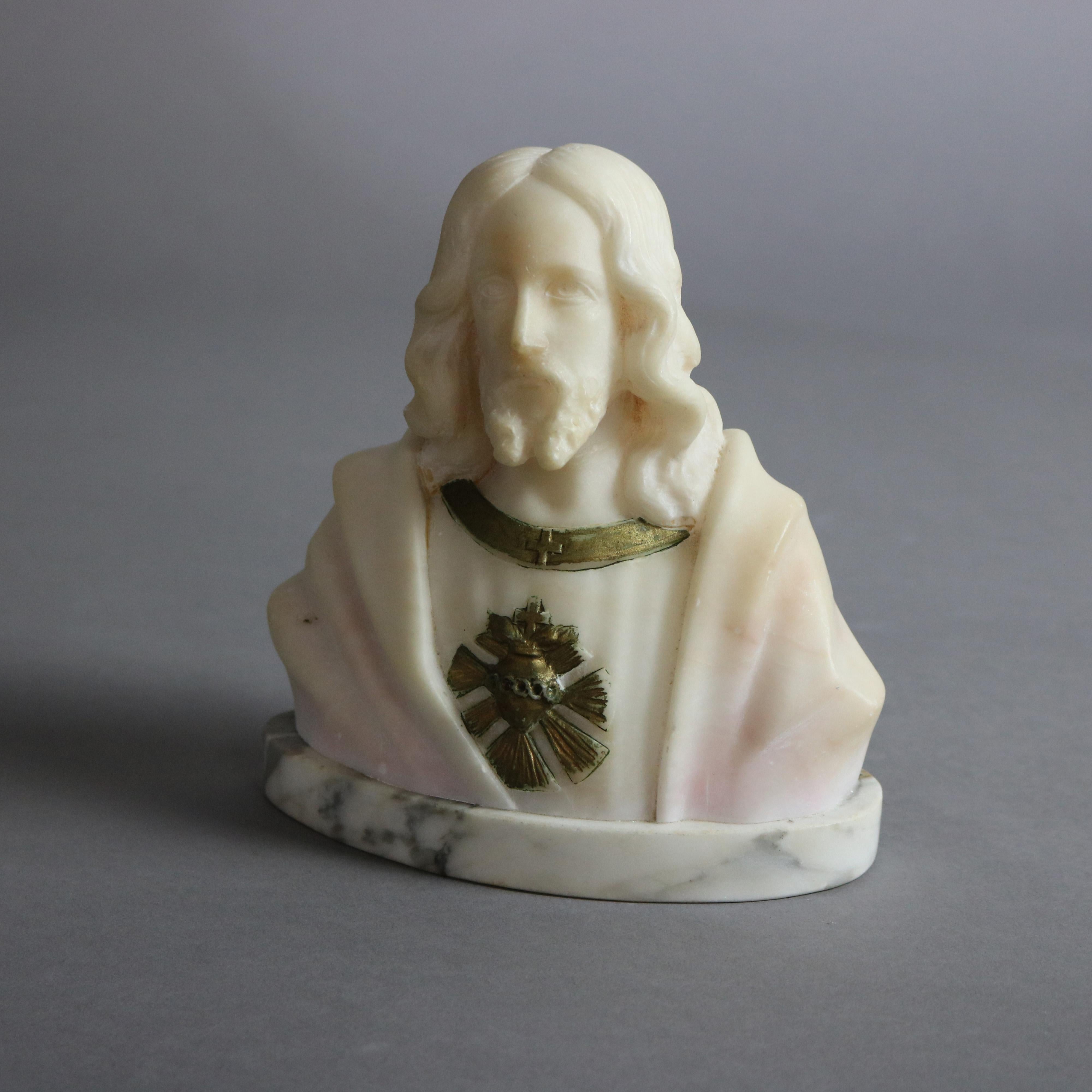 An antique Italian sculpture offers carved and parcel gilt alabaster bust of Jesus Christ, seated on marble base, c1890

Measures - 6.5'' H x 6'' W x 3'' D.