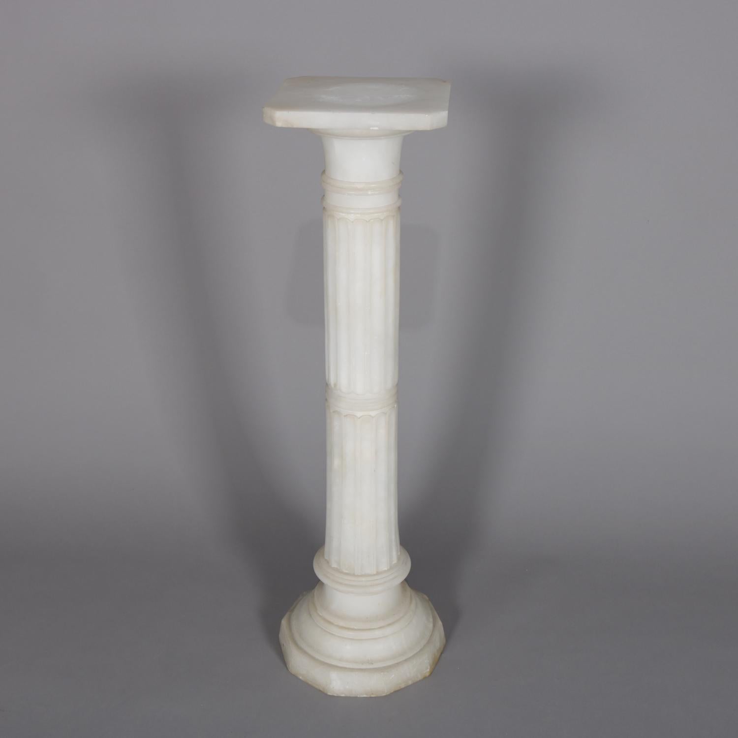 An antique Italian sculpture display pedestal features carved alabaster in reeded Classical Corinthian column-form and having clipped corner display and stepped base, circa 1890.

Measures: 40