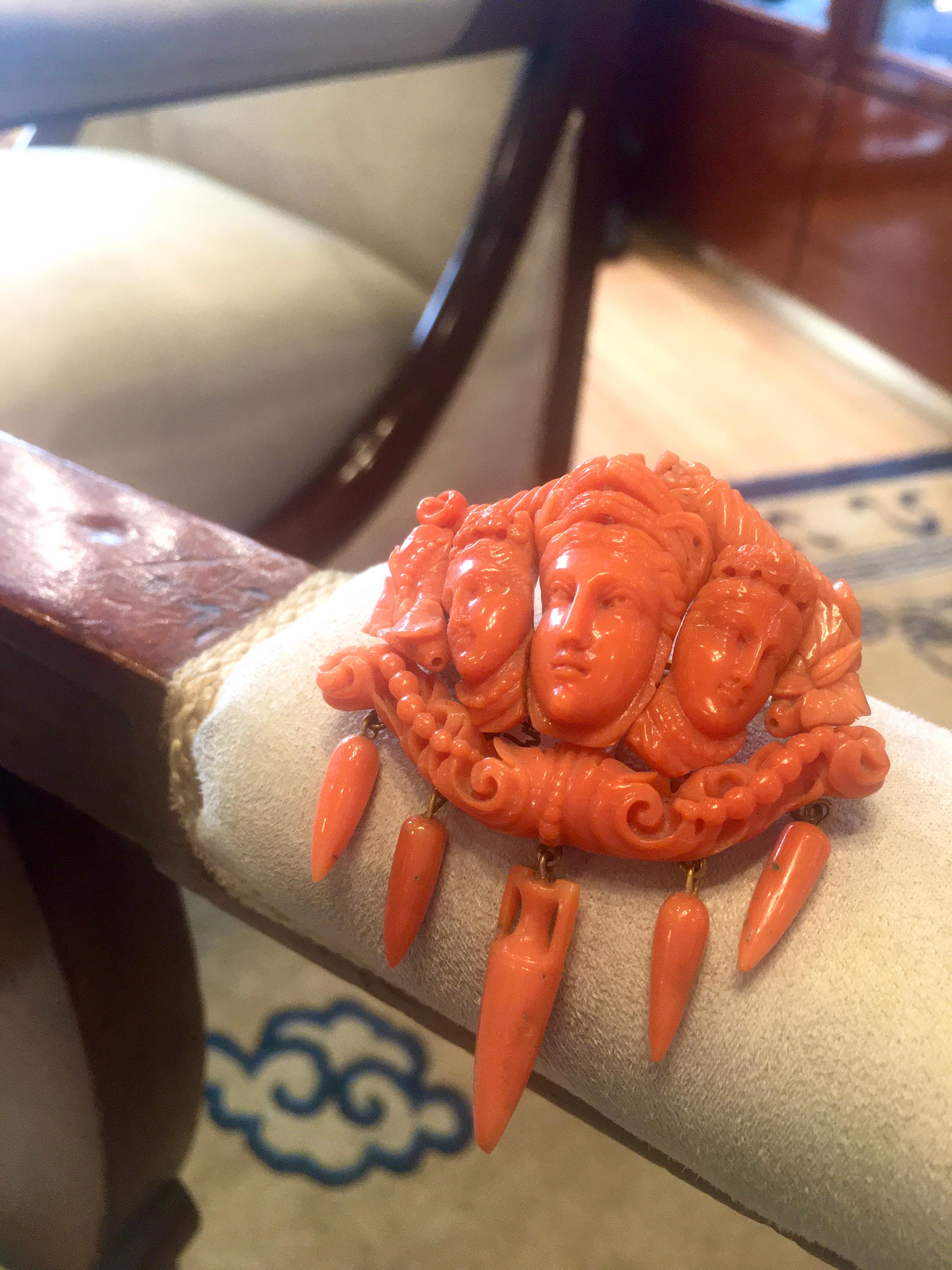 A beautiful antique nineteenth century carved coral brooch with a figural motif. Made in Italy.