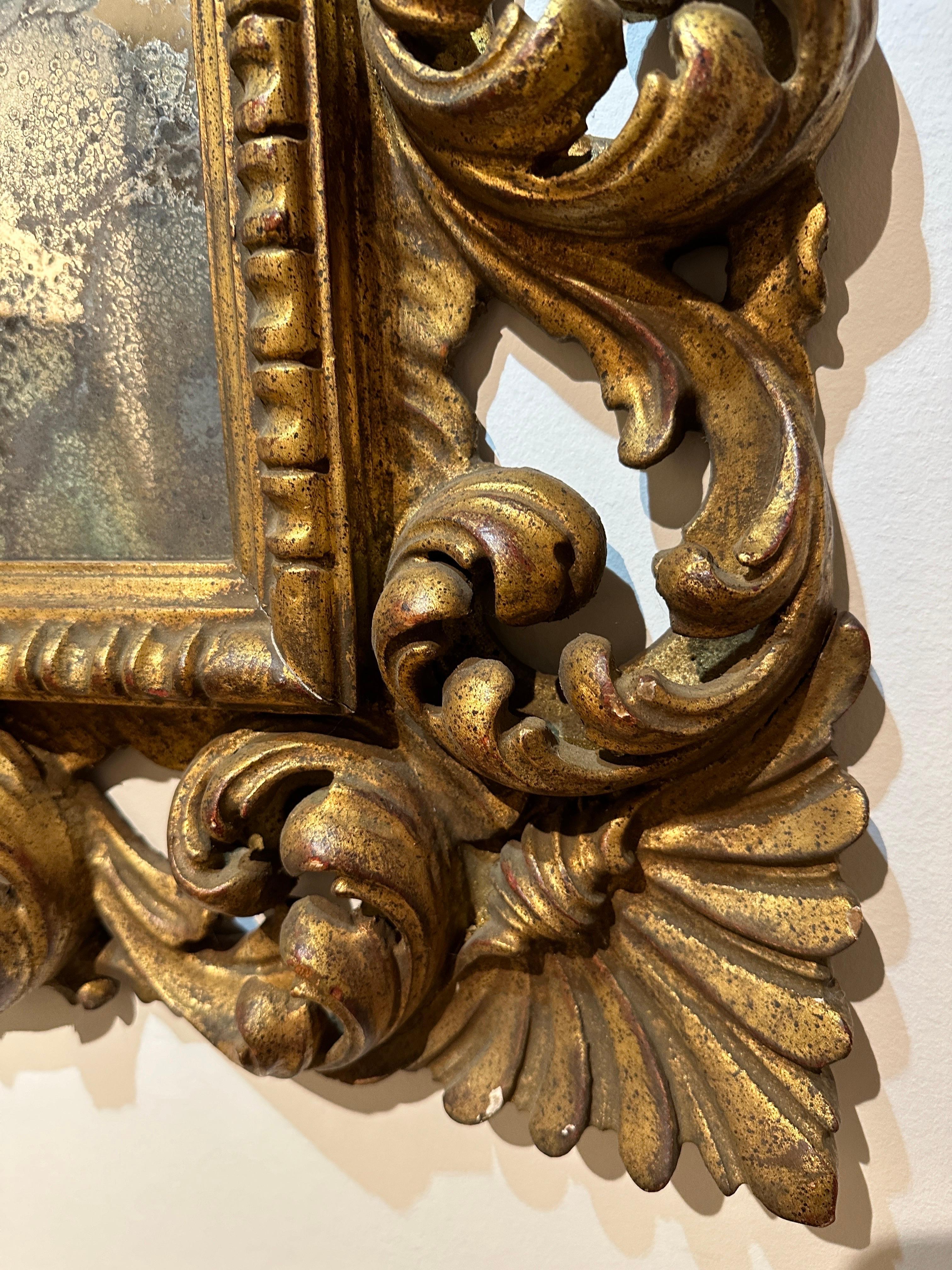 Antique Italian Carved Giltwood Frame and Antiqued Glass Wall Mirror In Good Condition For Sale In North Miami, FL