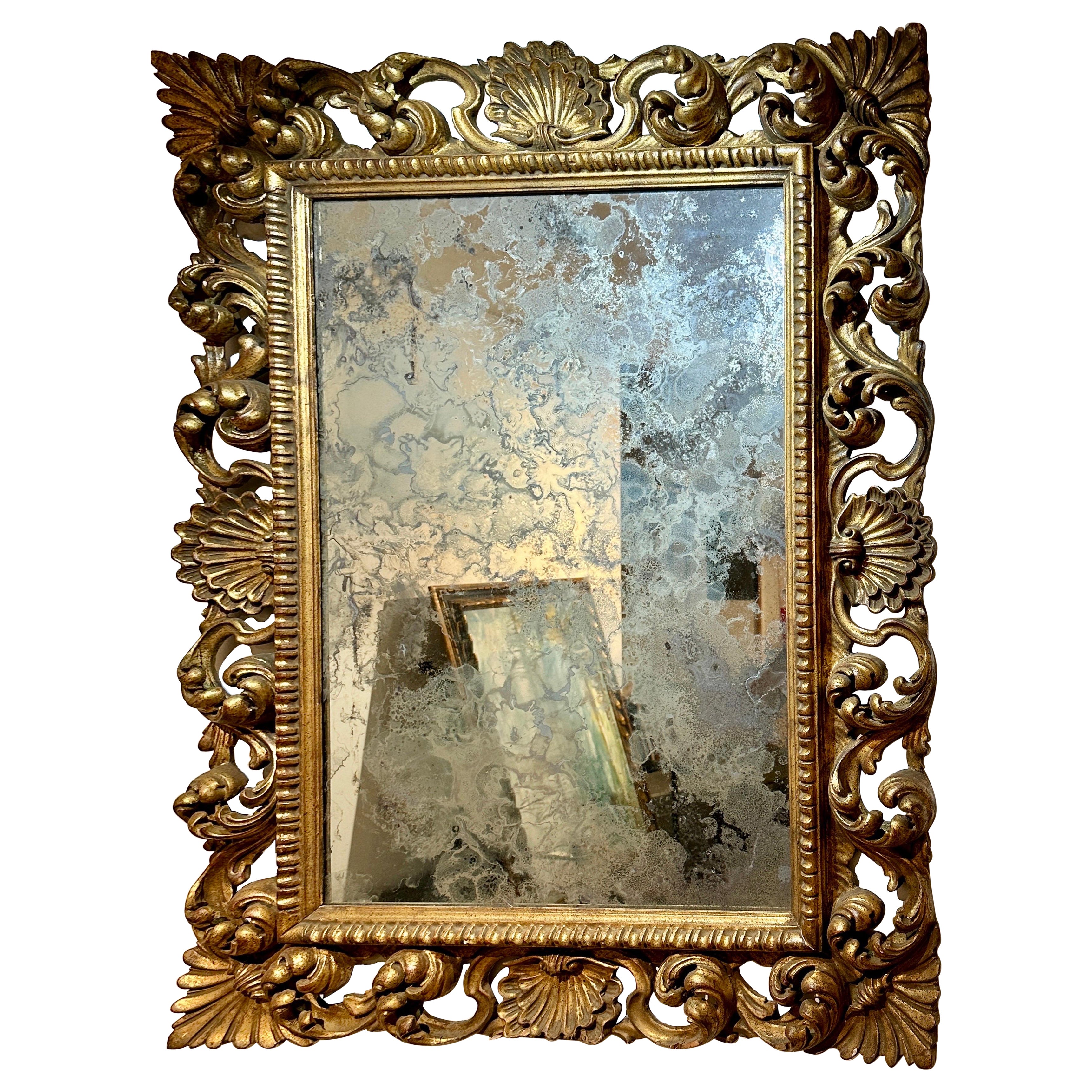 Antique miroir mural italien en bois doré sculpté et verre antique