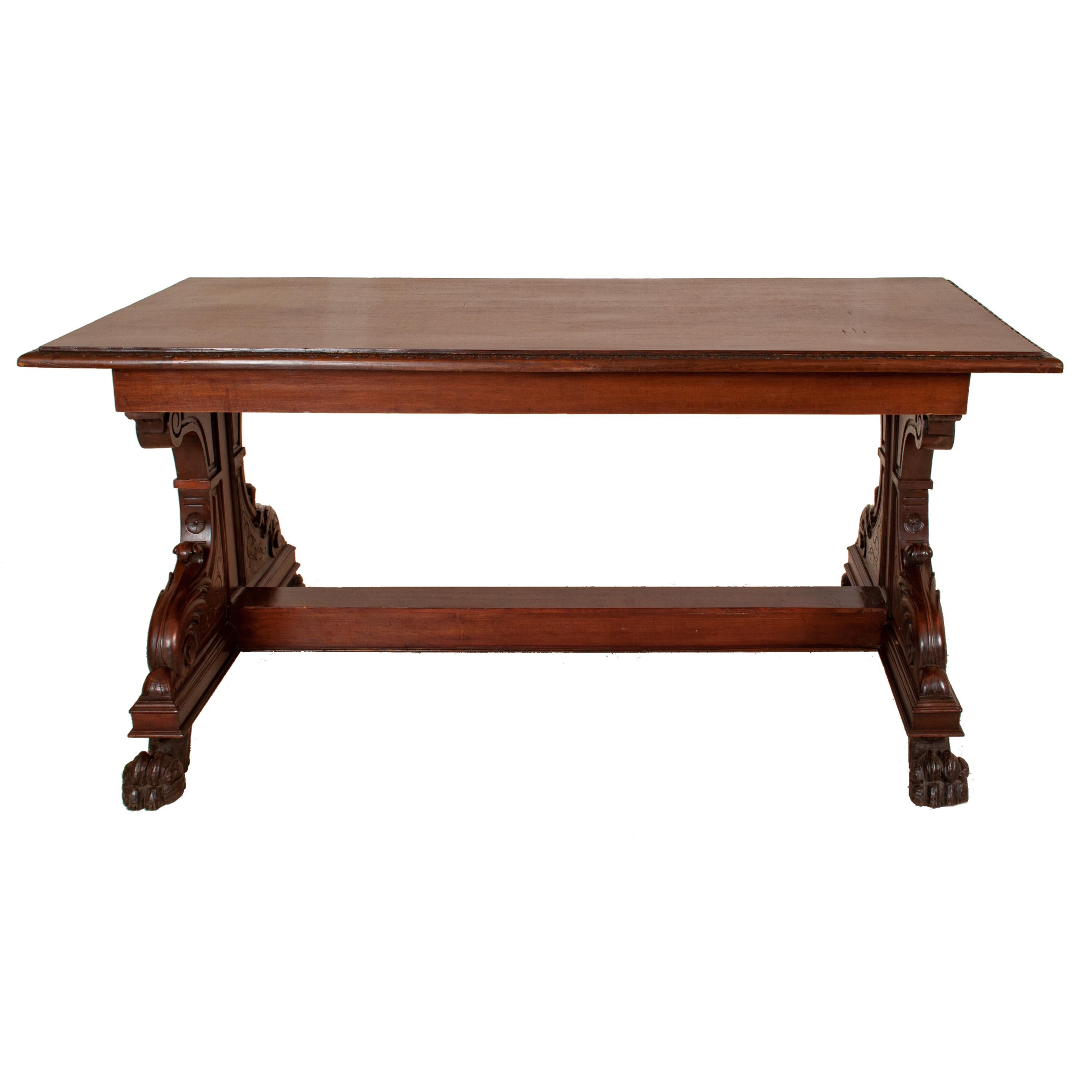 A very good antique Italian, Renaissance Revival carved walnut library/serving table, circa 1870.
The table top having a carved gadrooned edge with substantial carved supports at each end, the ends having incised carved decoration and acanthus leaf