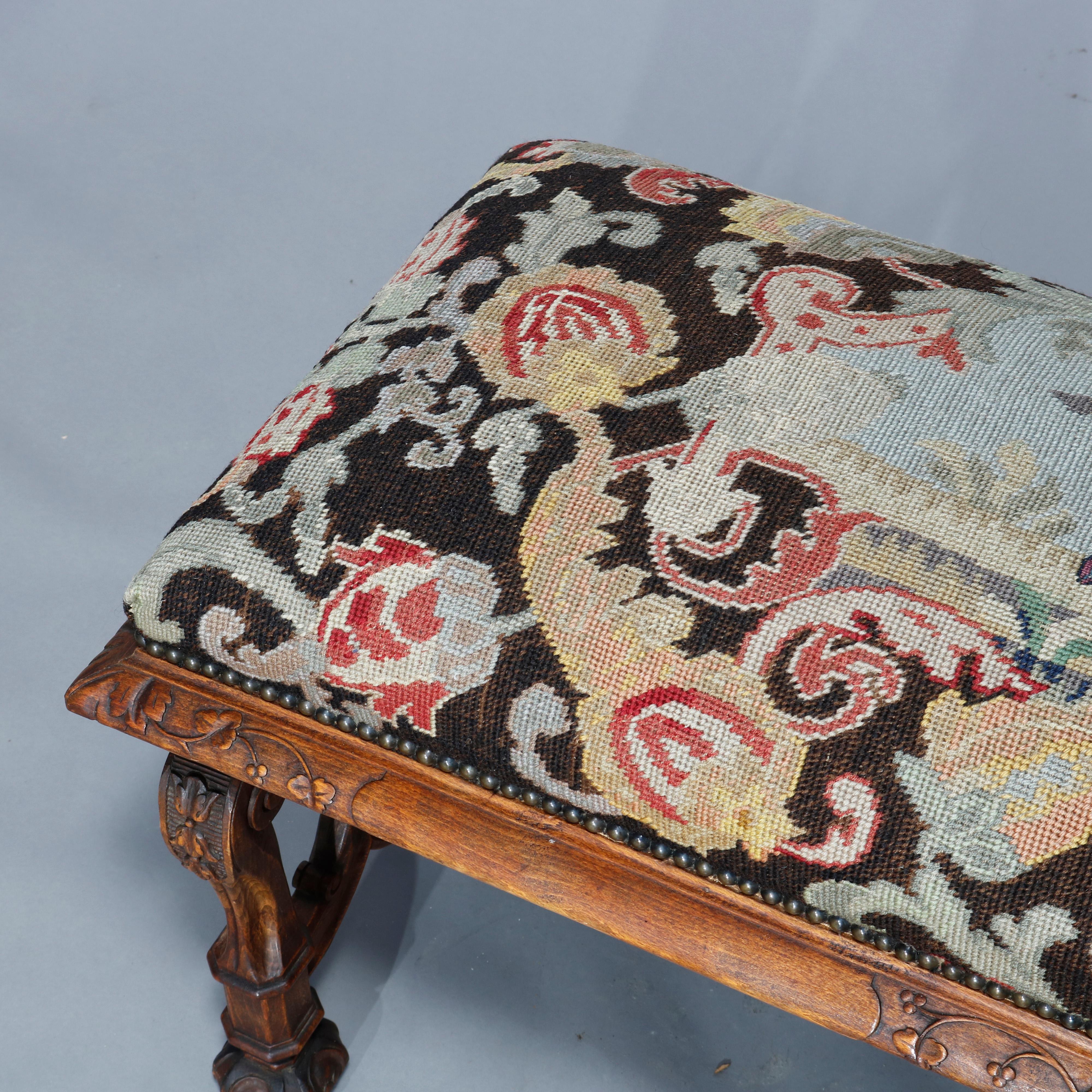 An antique Italian bench offers tapestry seat having courting scene with figures in countryside setting over carved walnut base raised on scroll form legs with scrolled foliate stretcher, c1890.

Measures: 19.5