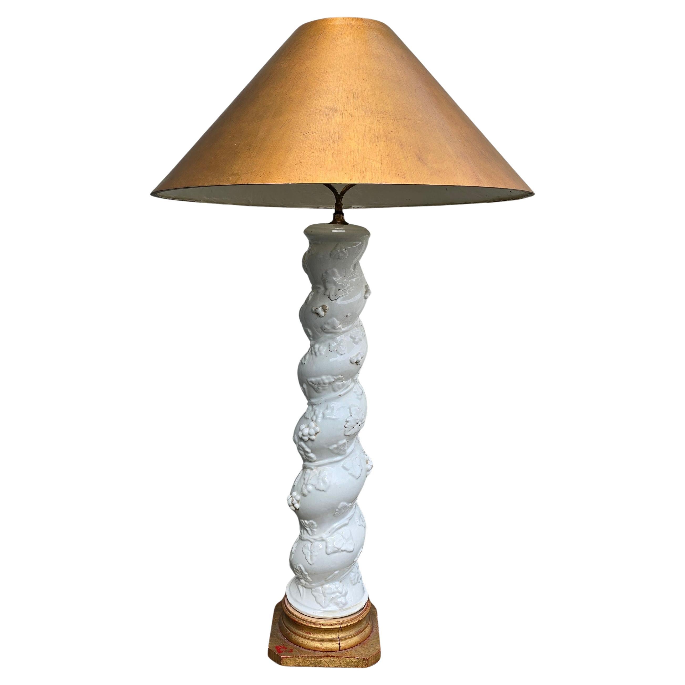Antique Italian Ceramic Lamp Base in Rococo Revival Style, Late 19th – Early 20th Century

A rare and striking ceramic lamp base featuring a twisted column form richly decorated with raised grapevine and leaf motifs. Crafted in white-glazed ceramic,