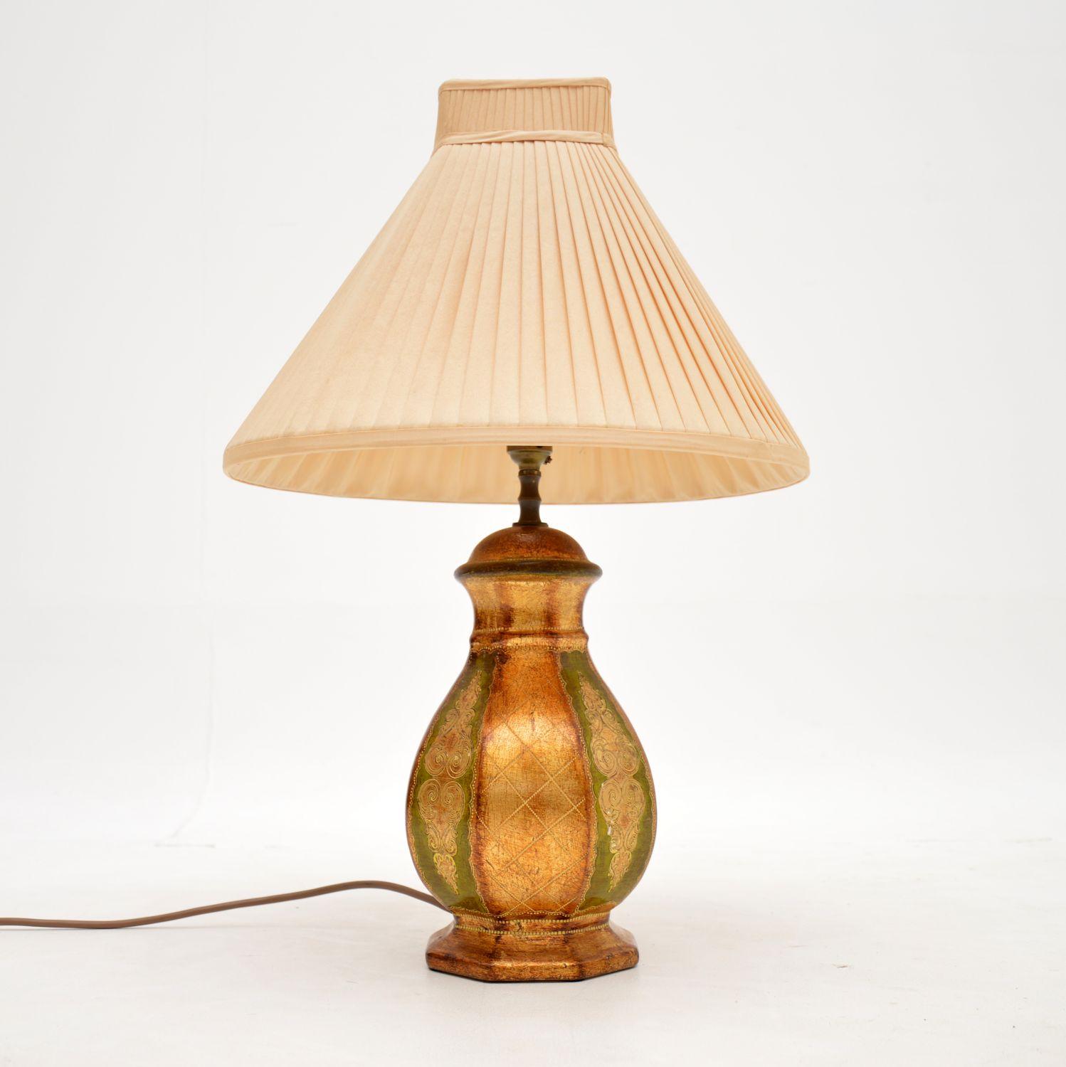 A beautiful vintage Italian ceramic table lamp, very much in the Venetian style. This was made in Italy, it dates from around the 1960’s.

It is of amazing quality, and is beautifully hand painted with gold and green tones.

The condition is
