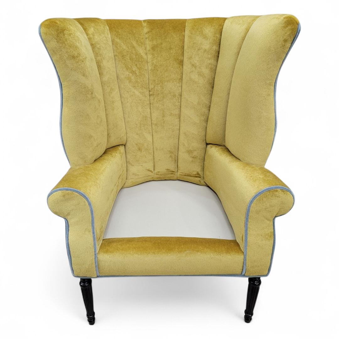 Antique Italian Oversized Channeled Barrel Back Armchair with Turned Walnut Legs in Mohair

This lounge chair with its channeled wing back design would be a distinctive accent chair in your home. It has been completely reupholstered in a high end