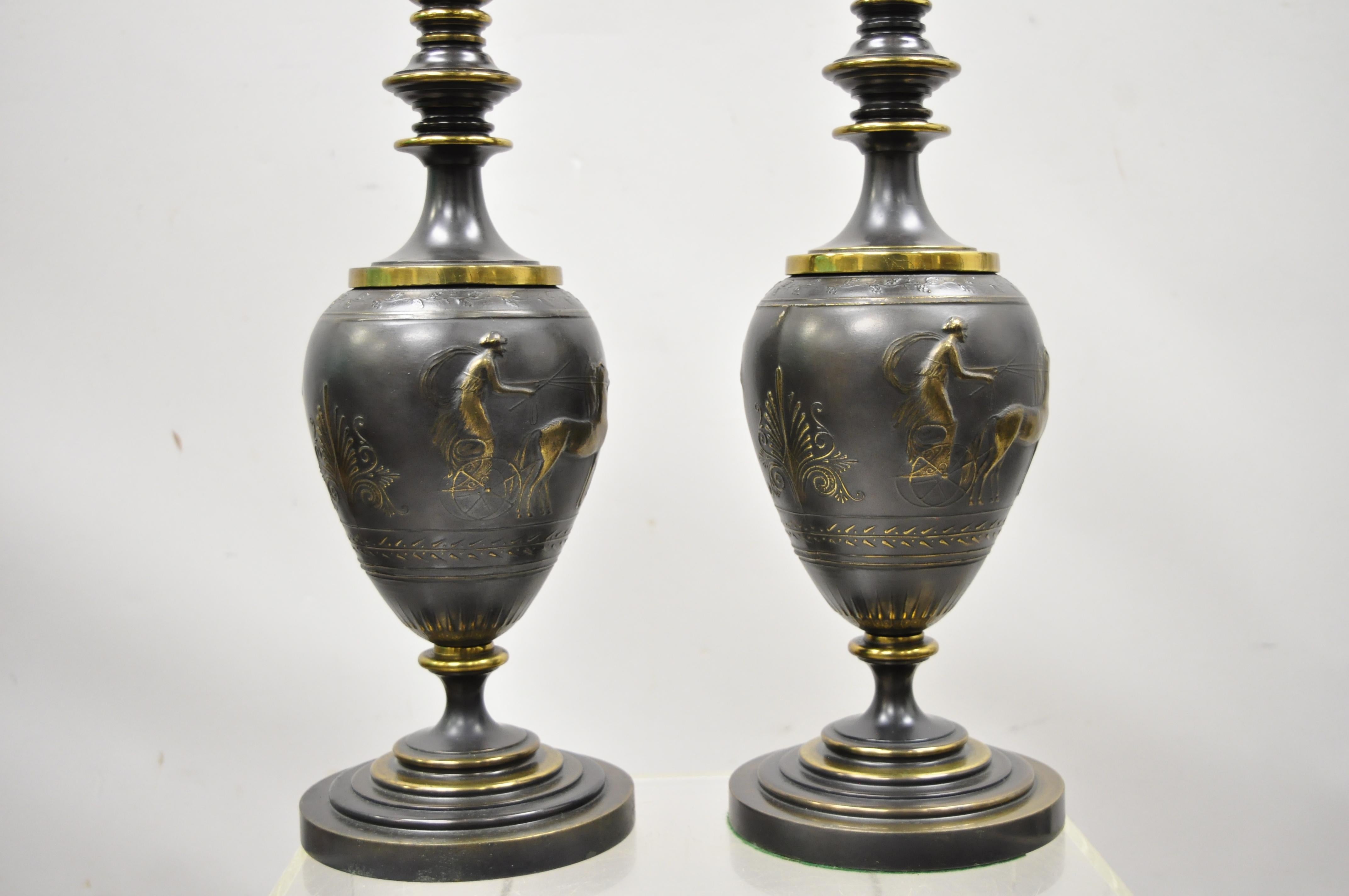 Antique Italian classical bronze finish metal bulbous empire style figural table lamps, a pair. Item features figural classical bulbous bodies with chariot riders, 3-light sockets, brass accents, very nice antique pair, circa early to mid-20th