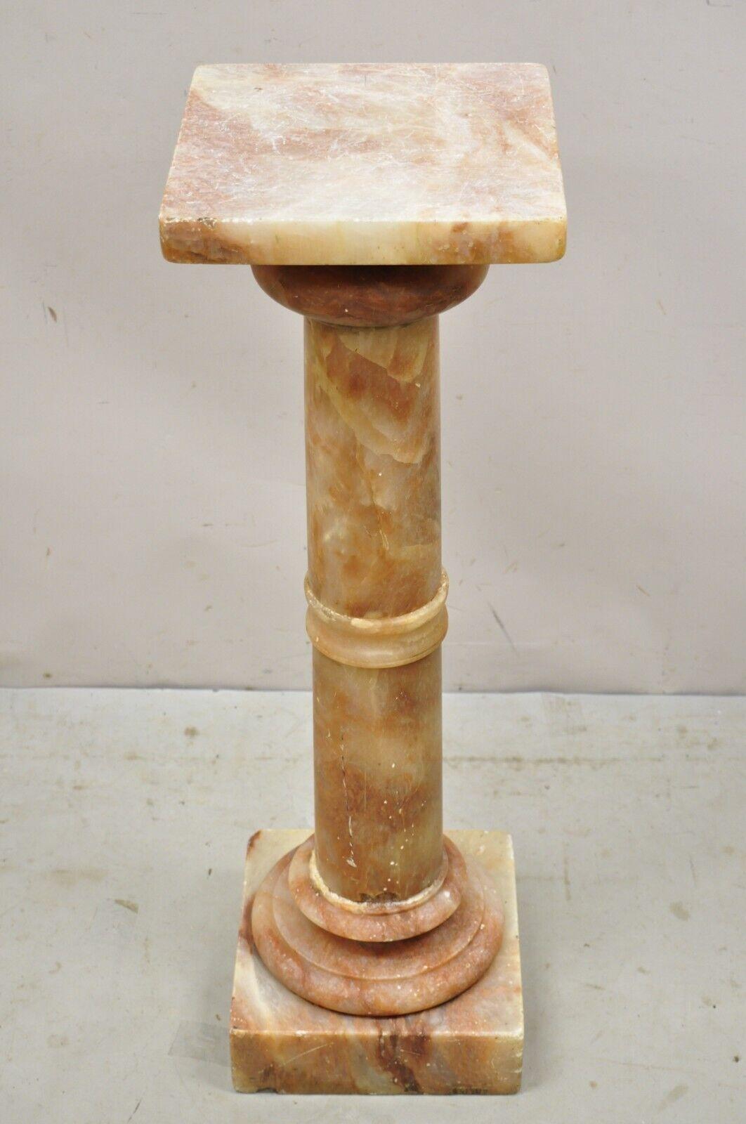 Antique Italian Classical Rouge Onyx stone marble column pedestal stand. Item features rouge translucent onyx stone, square top, beautiful veins, very nice antique item. Circa Early 1900s. Measurements: 38.5