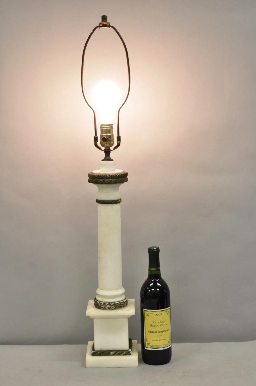 Antique Italian Classical White Carved Marble Empire Column Table Lamp with Dark Gold Painted Accents. Circa Early 20th Century. Measurements: 34