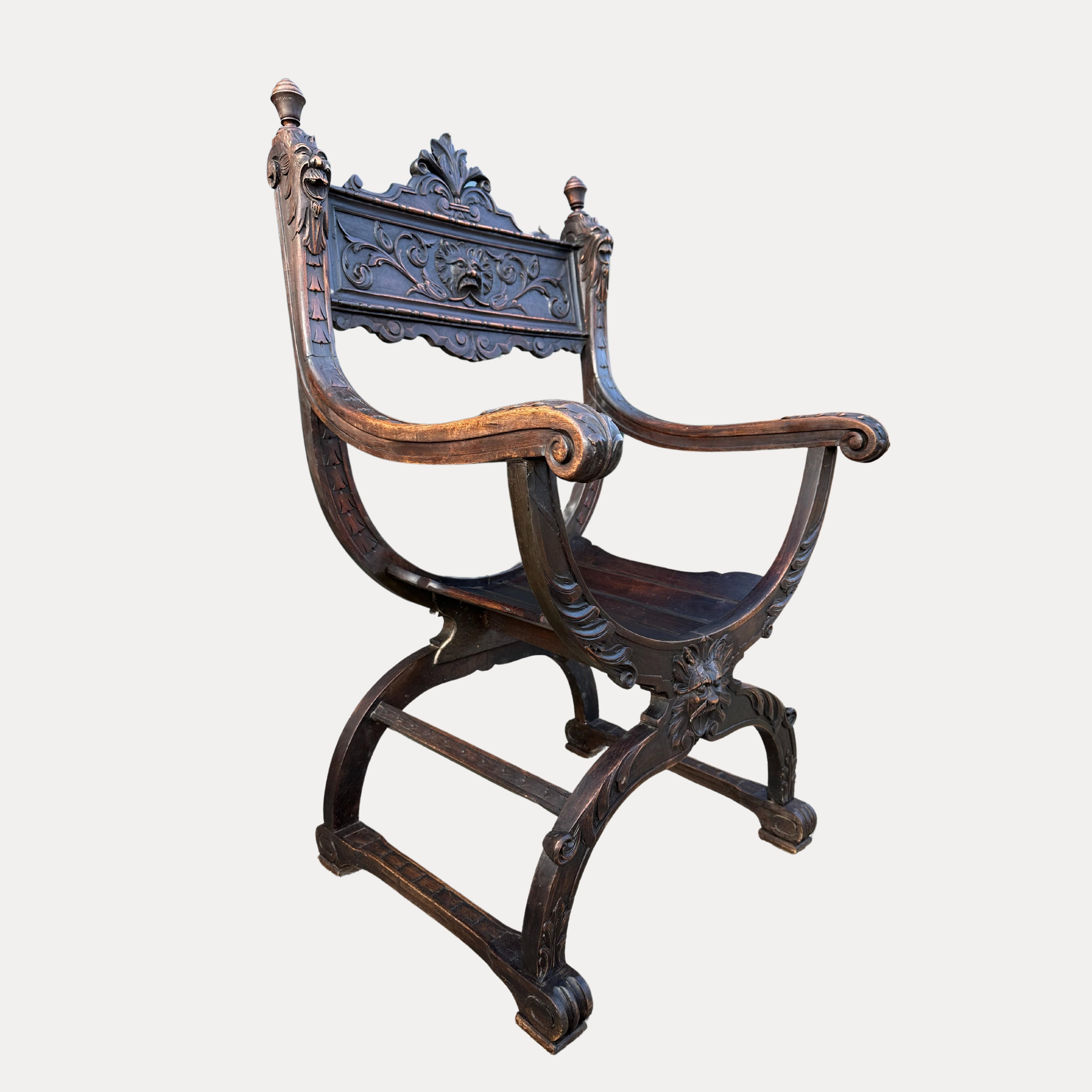 Magnificent 19th century Renaissance Revival Curule/Savonarola chair originating from Italy circa 1880.
Highly desirable carvings depicting the Face of the North Wind.
This beautiful chair has heads and faces intricately carved on the chair