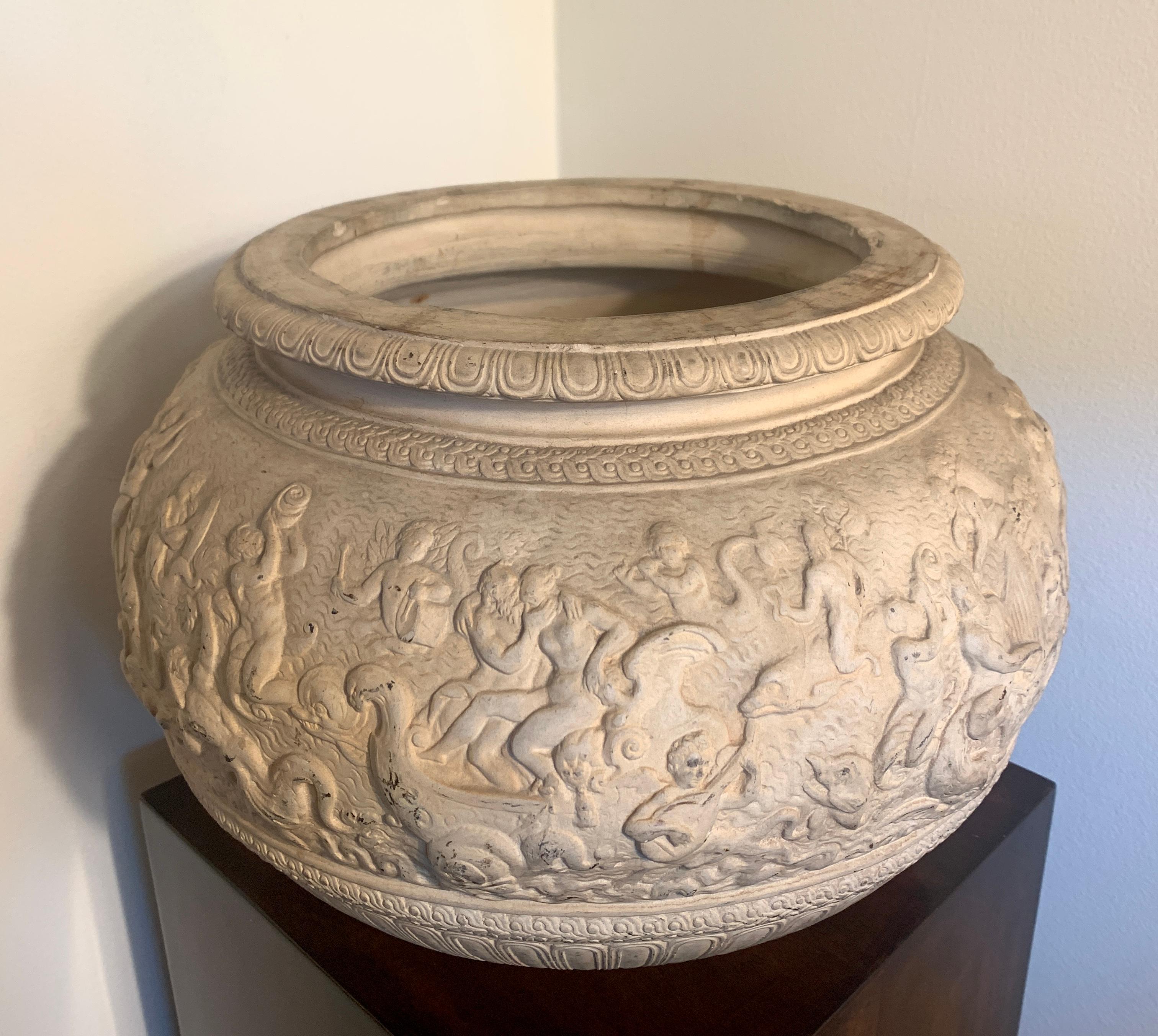 Beautifully detailed Dini e Cellai Signa Terracotta planter. Whimsical mythological scenes of Gods, Goddesses and frolicking putti playing music and dancing. Lovely patina, looks as beautiful empty as it does when filled with flowers or a grouping