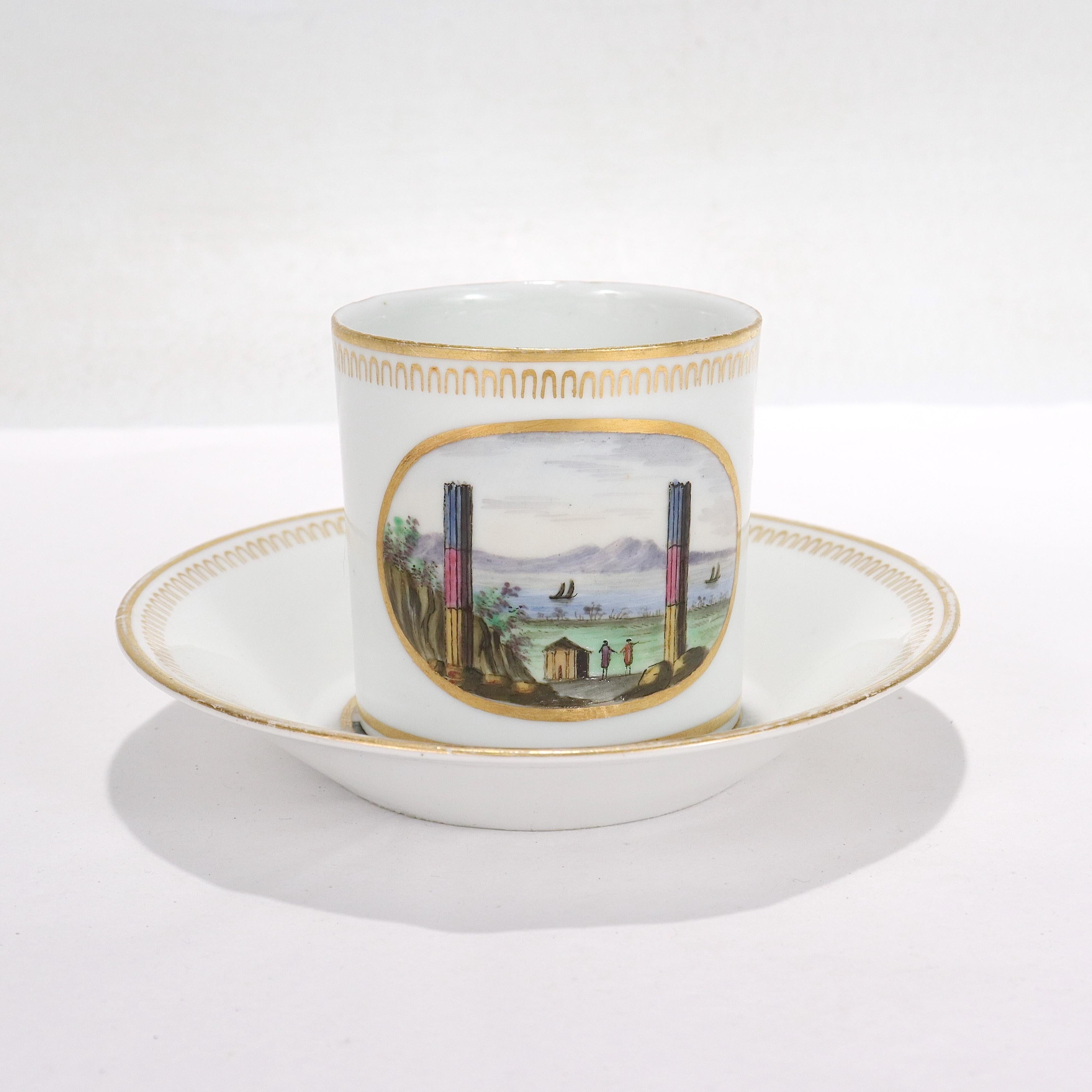 A very fine antique Italian Doccia Topographical porcelain neoclassical cup & saucer.

By Doccia Porcelain Manufactory circa 1820.

With painted enamel topographical scenes: the cup depicting 