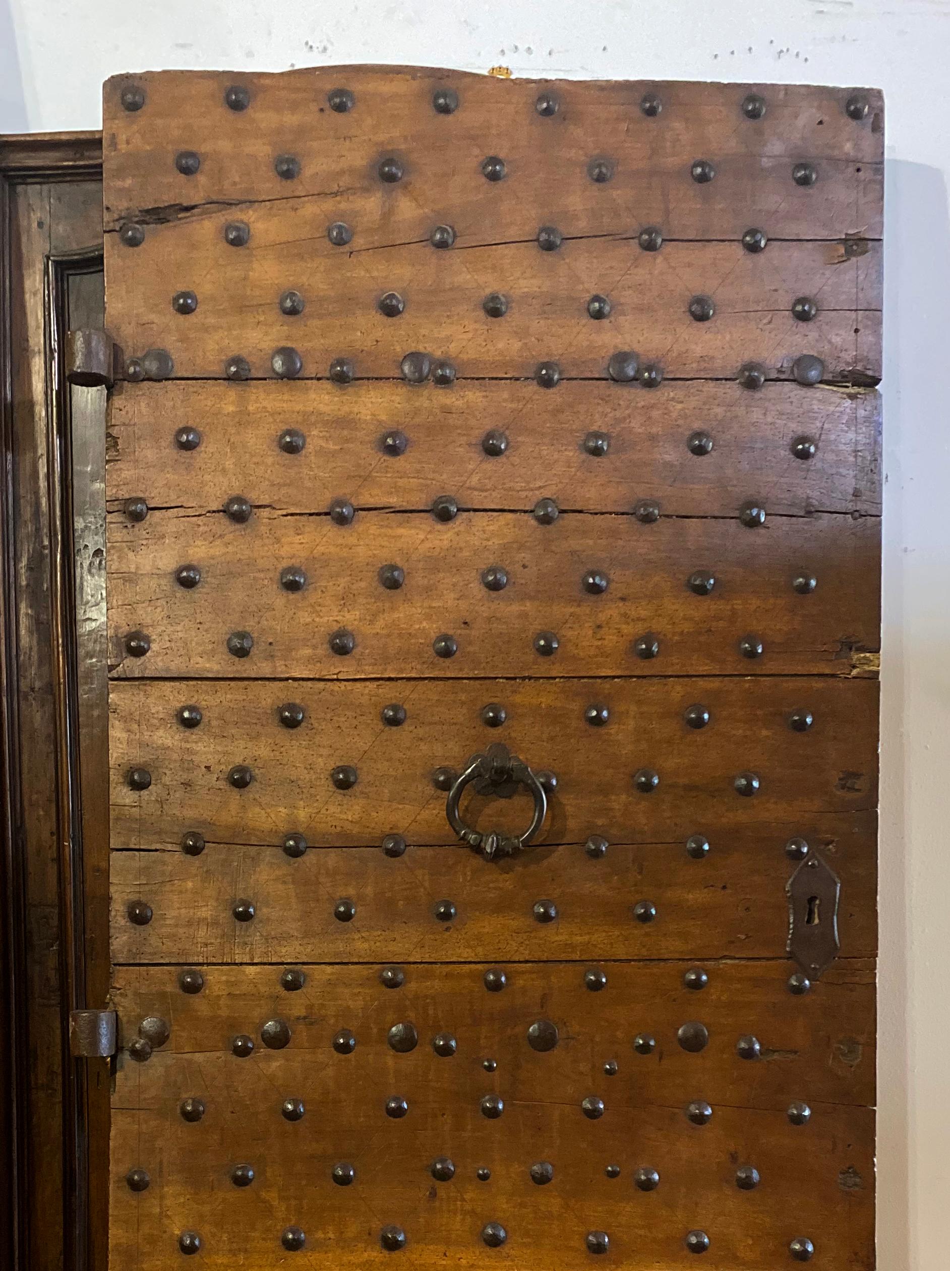 Stunning antique Italian door with original iron hardware.

Measurements: 40.5