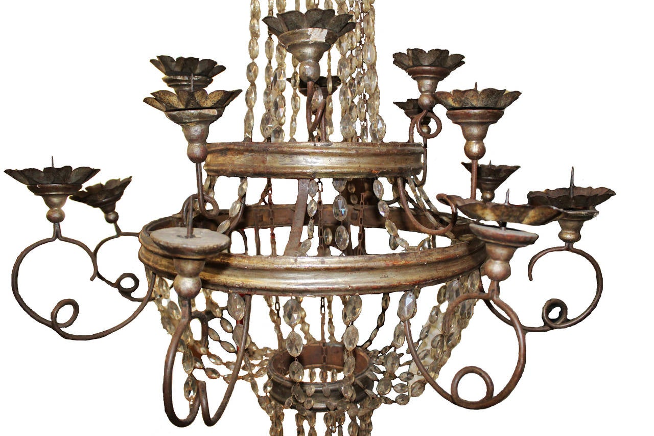 19th century Italian silver leaf Empire chandelier. Wear consistent with age. One leaf missing from the top crown and two Iron bobeche. Wired for electrical use. 