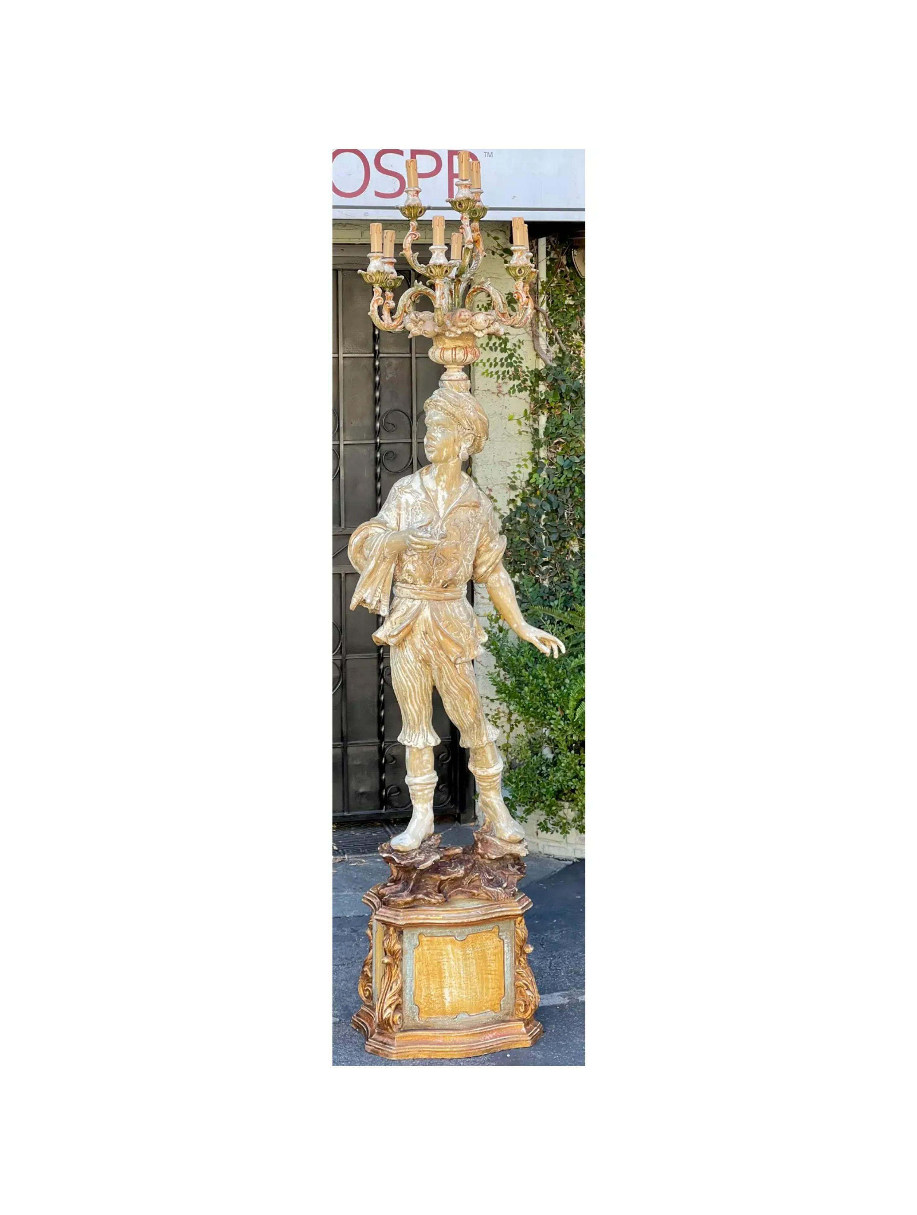 Antique Italian Figural standing candelabra floor lamp. It features a standing figure on a plinth with a candelabra stemming from his head.

Additional information: 
Materials: Lights, Wood
Color: Beige
Period: Early 20th Century
Styles: