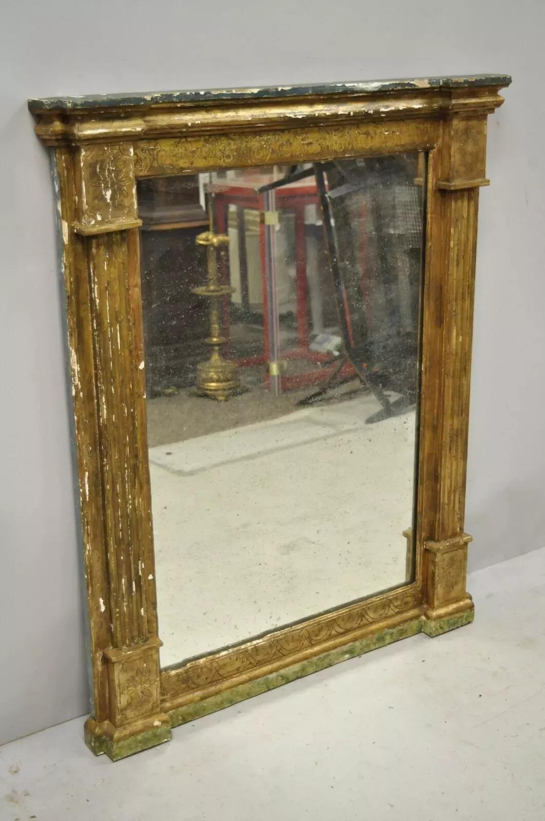 Antique Italian Classical Florentine Giltwood Distressed Gold Looking Glass Wall Mirror. Item features a desirable authentic distressed finish to giltwood frame, aged looking glass mirror, solid wood frame, nicely carved details, very nice antique