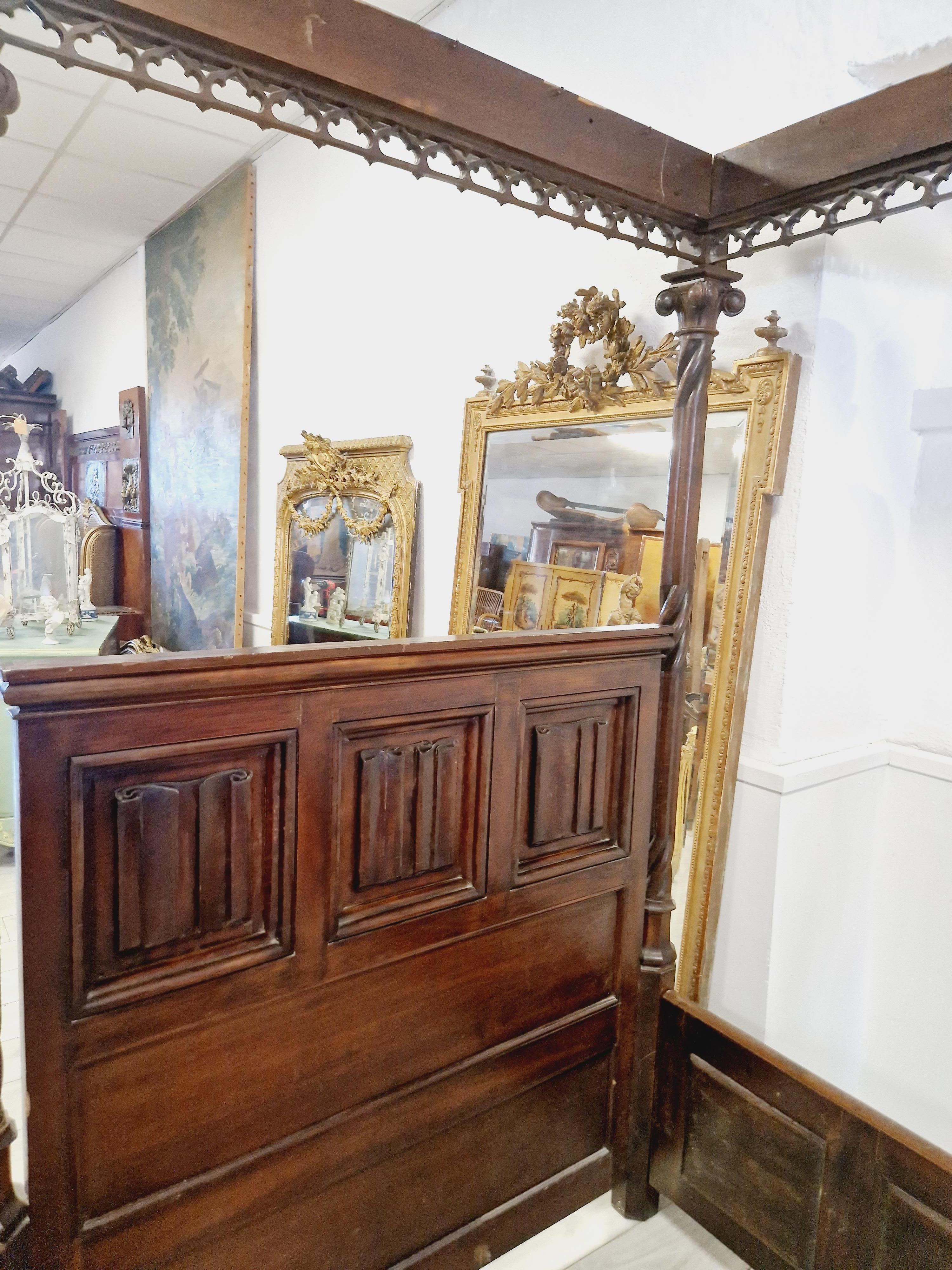 This Fabulous Antique 19th Century Sicilian Gothic style Bed is a stunning example of an Italian Decorative Antique, with intricate carvings and a full canopy above with ready hooks for the curtains. The bed is of solid wood in a dark Sicilian wood.