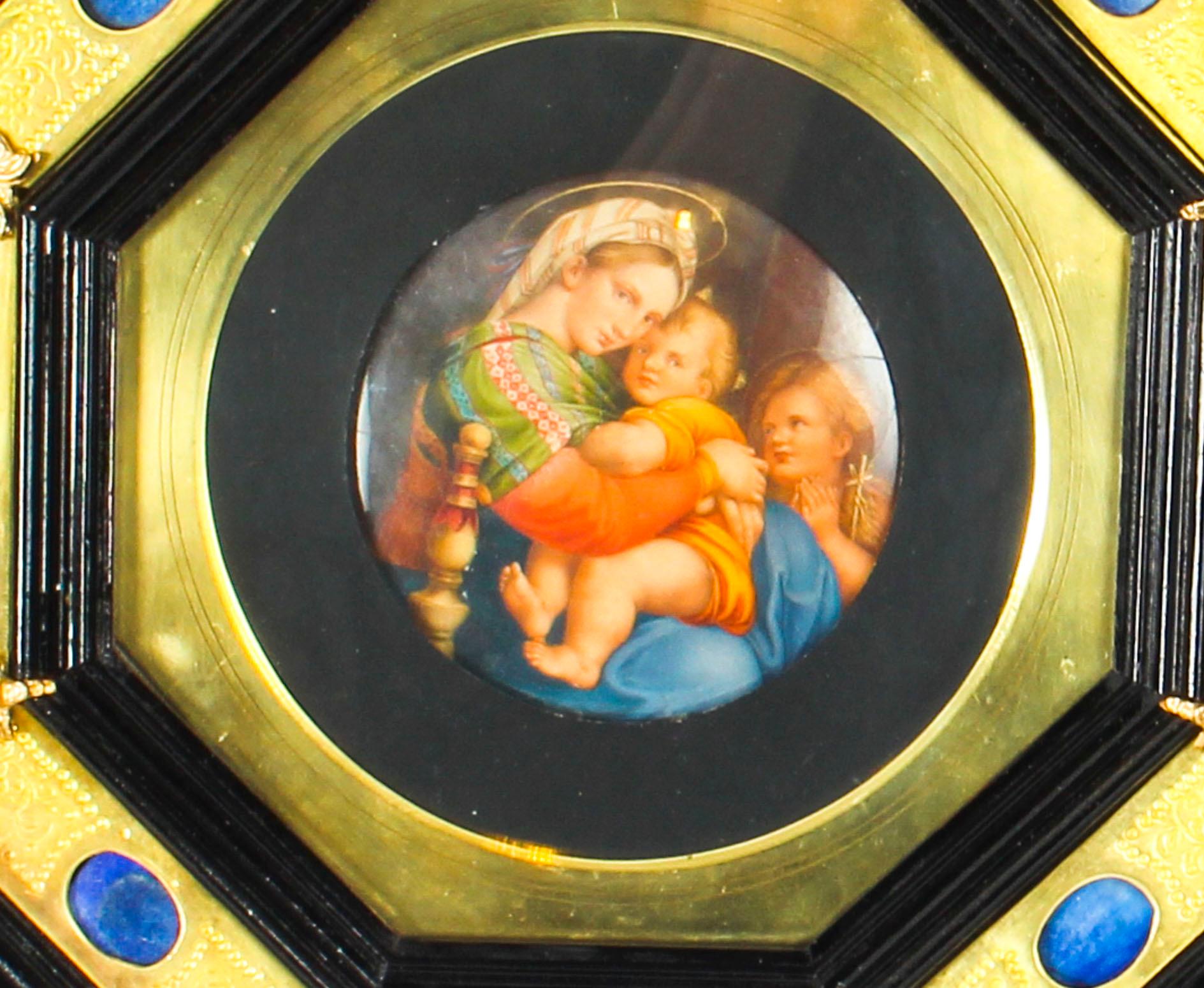 This is a magnificent antique Italian hand-painted oval miniature of the Madonna Della Seggiola, circa 1840 in date. 

This truly stunning oval miniature is housed in a highly decorative ebonised and brass octagonal frame that has a plethora of