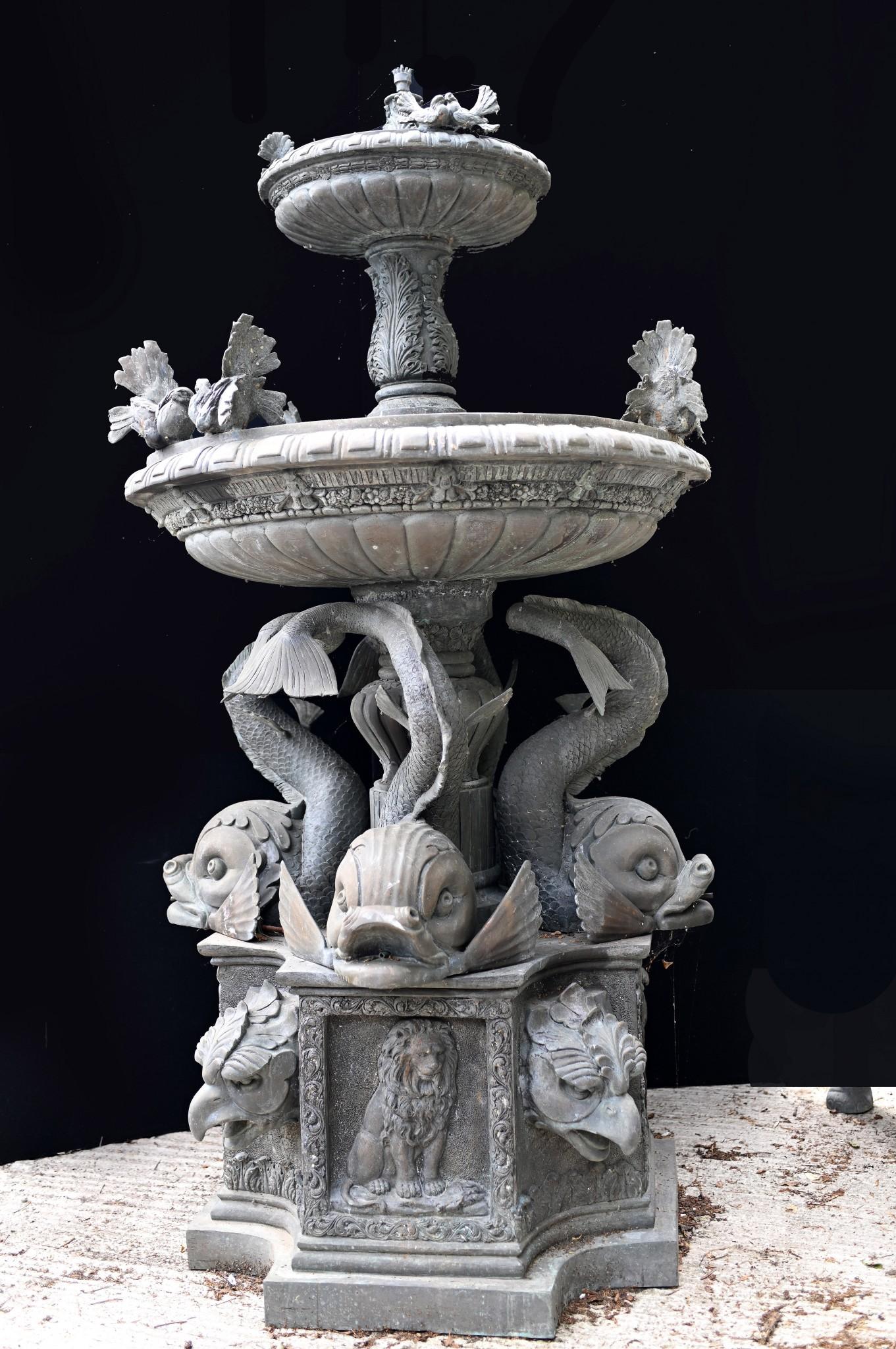 Stunning Italian antique garden fountain in bronze
Great work of classical beauty with main column supported by sea serpents
Believed to be salvaged from a town near Trieste in Italy
Two tiers to the fountain with birds on the rim
Also features