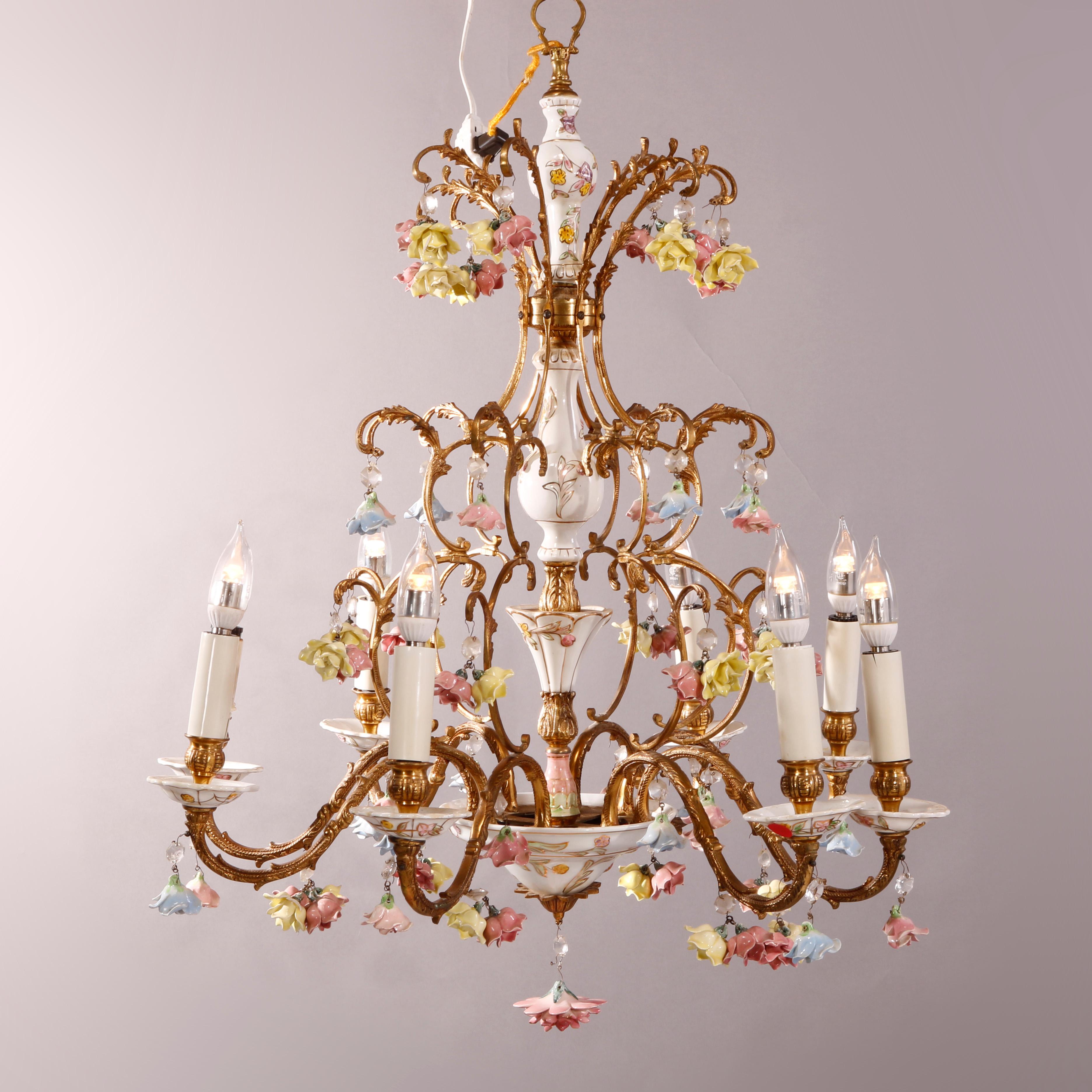 An antique Italian style chandelier offers gilt bronze foliate form frame with eight arms terminating in candle lights, hand painted and gilt porcelain inserts and flowers throughout, crystal highlights, 20th century

Measures - 33.5'' H x 22.5'' W