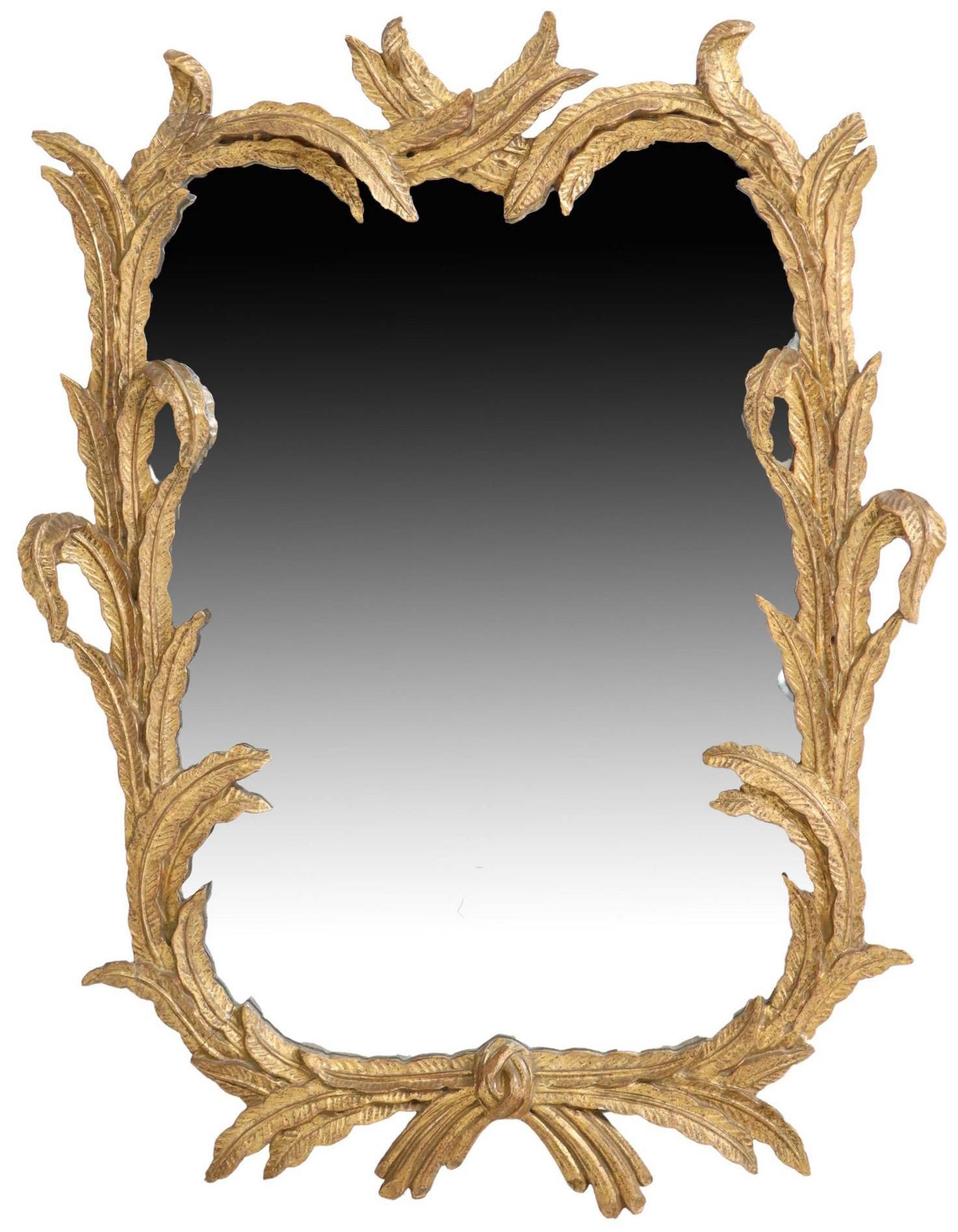 Antique Italian gilt carved wood wall mirror, early 20thc., having foliate frame, encasing flat mirror plate.

Dimensions
approx 37.75