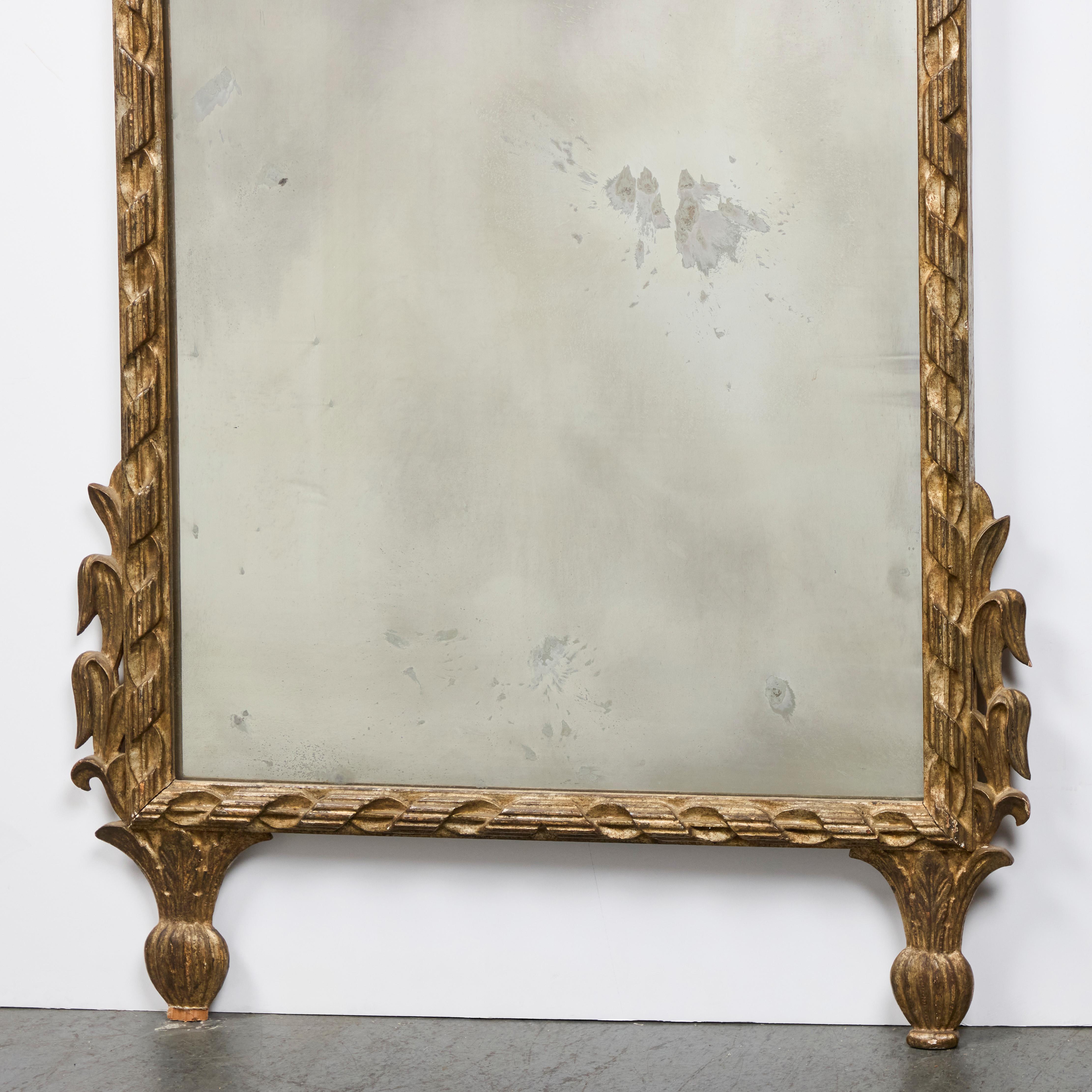 Hand-carved and gilded, framed mirror.  Original glass with age-appropriate loss of silvering to plate