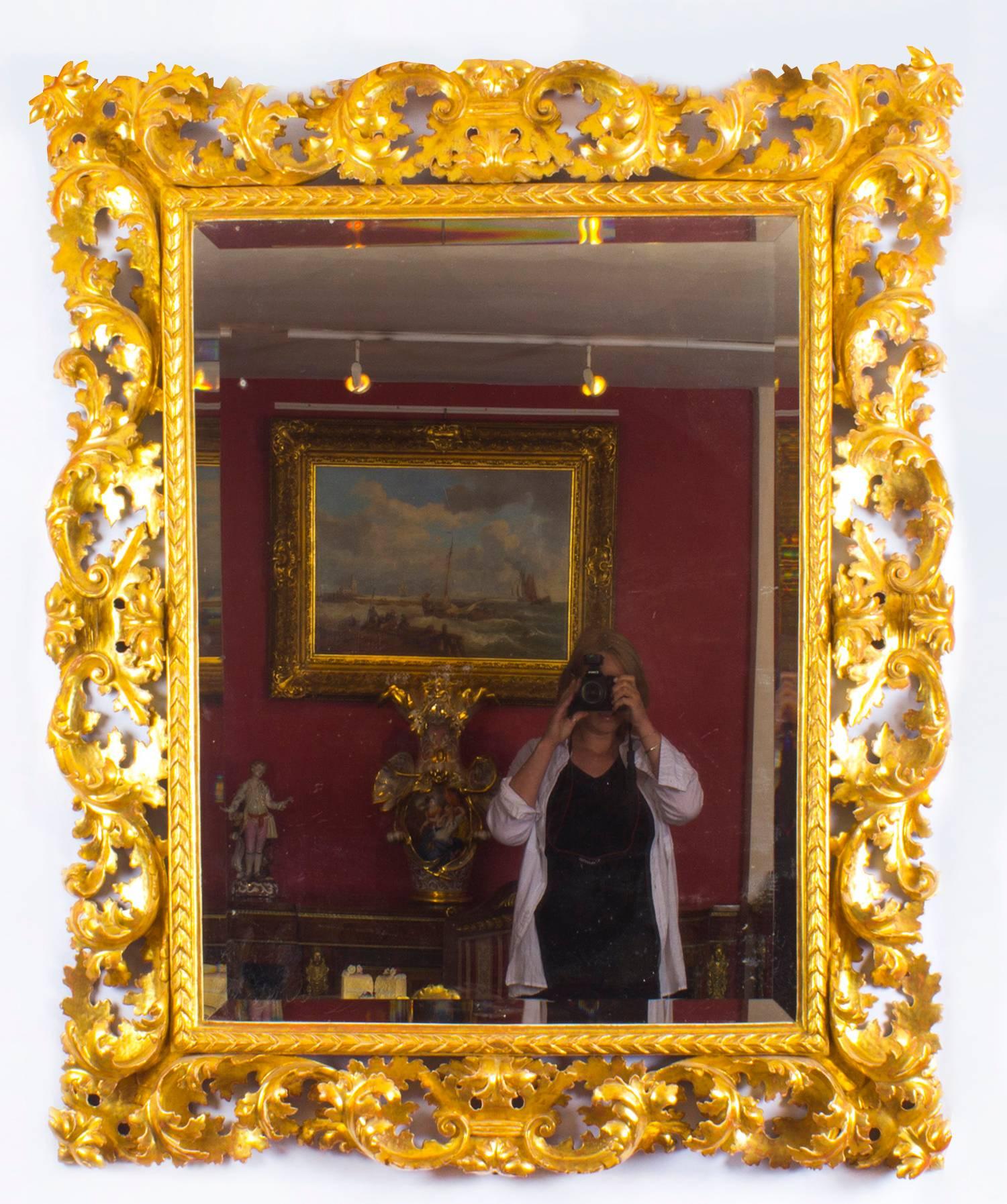 A superbly carved and highly decorative fine museum quality Florentine giltwood overmantle mirror, mid-19th century in date.
 
This rectangular mirror consists of a superbly carved giltwood frame with an arrow beaded border with scrolling acanthus