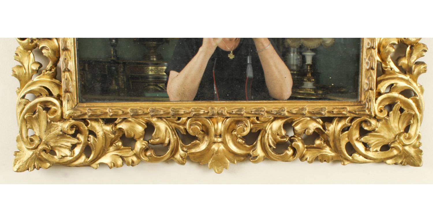 A superbly carved and highly decorative fine quality Florentine giltwood overmantle mirror, mid 19th Century in date.
 
This rectangular mirror consists of a superbly carved giltwood frame with an arrow beaded border and scrolling acanthus leaf