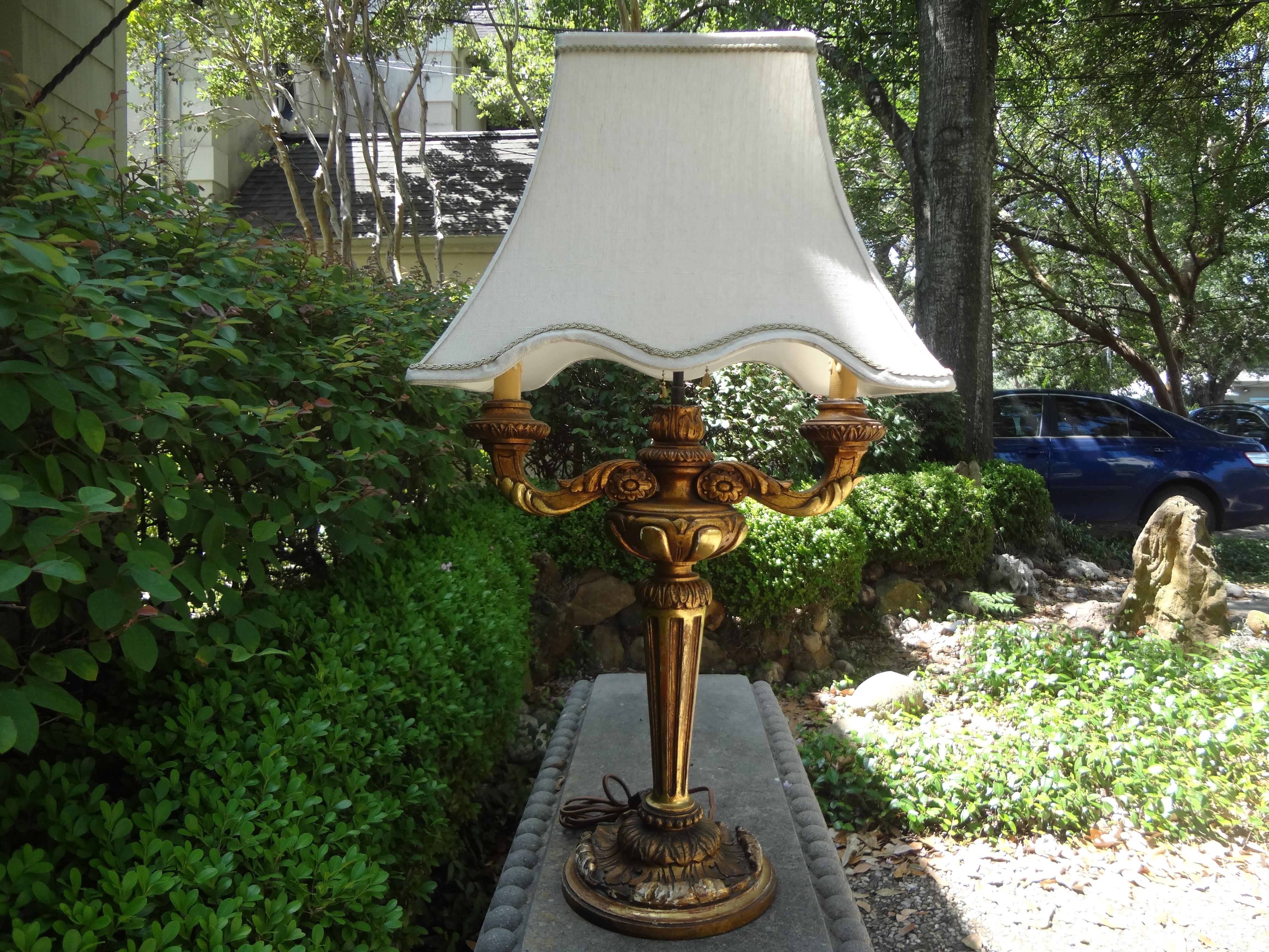 Antique Italian giltwood lamp.
Stunning antique Italian giltwood lamp. This lovely Italian gilt lamp has been newly wired to U.S. specifications. Gorgeous patina.
Dimensions of lamp only: Shade not included. Not in usable condition and best to