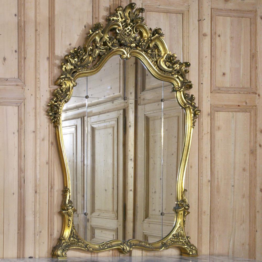 Completely sculpted from solid wood then given a sublime gilded finish as only aster Italian artisans can do, this stunning antique Italian Rococo giltwood mirror was designed to impress anyone who entered the room! Elaborate naturalistic sculpture