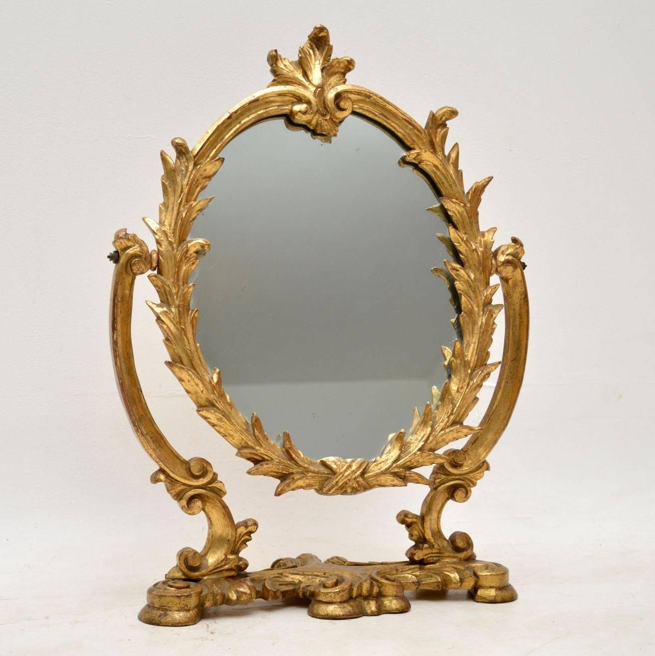 Antique carved giltwood vanity mirror in excellent original condition. I believe this is Italian from circa 1920-1930s period. The gilt finish has just the right amount of wear, which give this piece loads of character.

Measures: Width 17 inches,