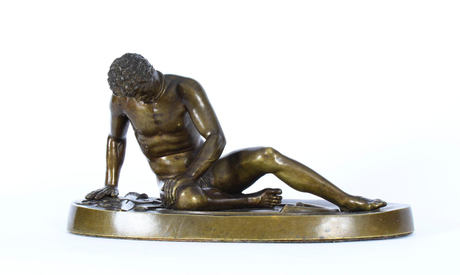 This is a truly magnificent antique Italian Grand Tour figural bronze sculpture depicting a wounded gladiator known as 