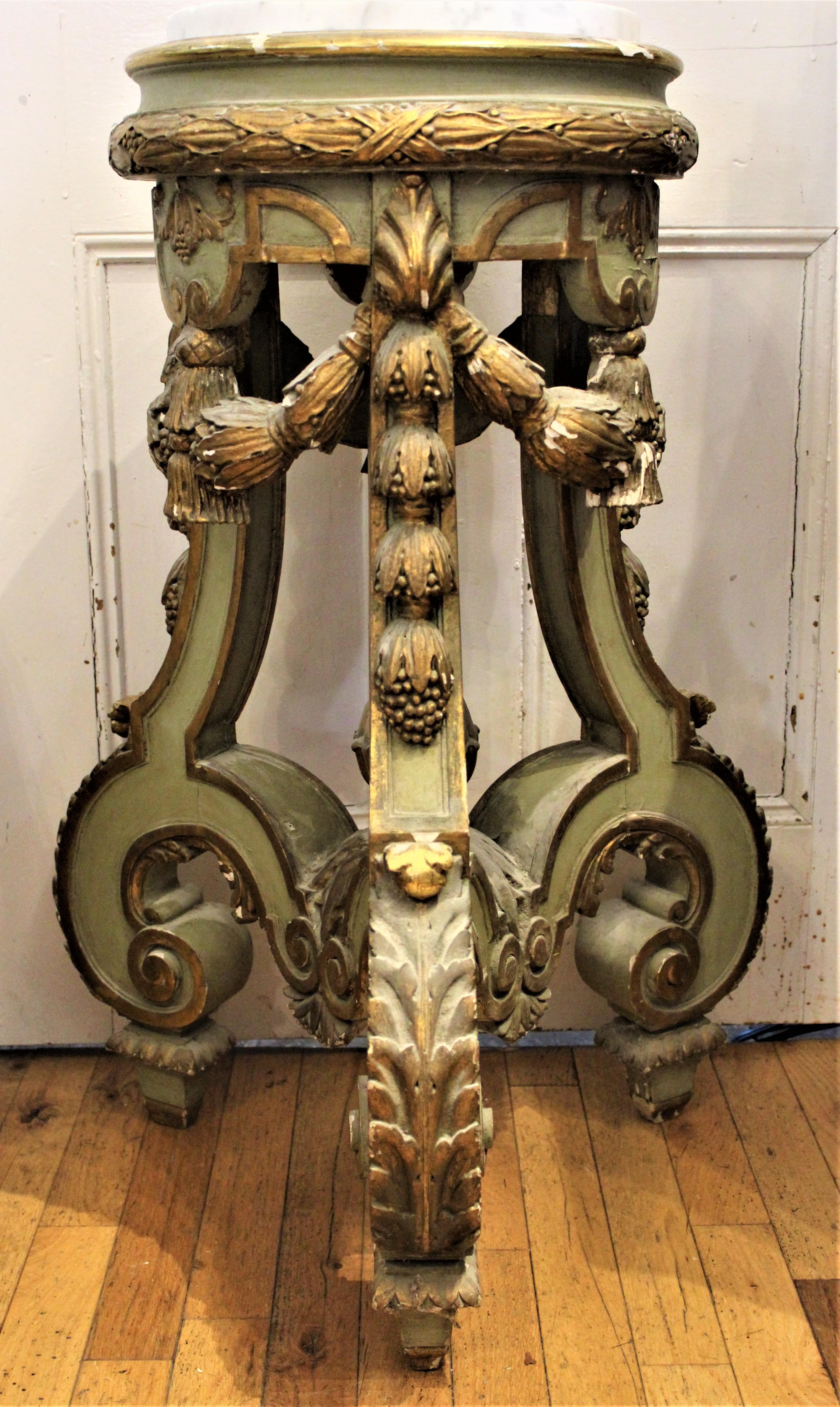 Done in the Rococo style and dating from the mid-19th century, this substantial hand carved and painted gesso over wood pedestal presents with a ball motif decoration cascading down each of the thick serpentine shaped legs and finishing with a