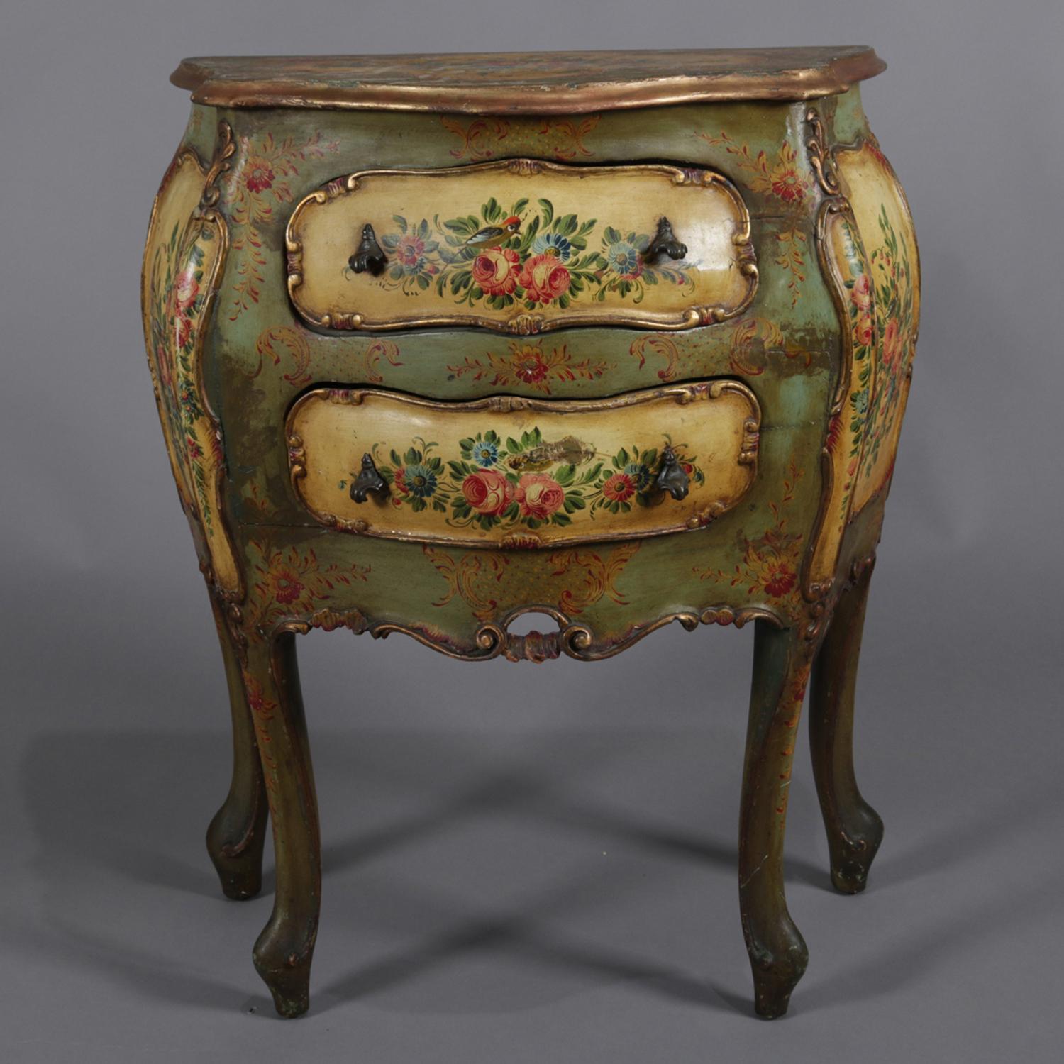Antique Italian commode features bombe form with shaped top over case with two drawers and is hand-painted with floral decoration and gilt highlights and raised on cabriole legs, 19th century

Measures: 30