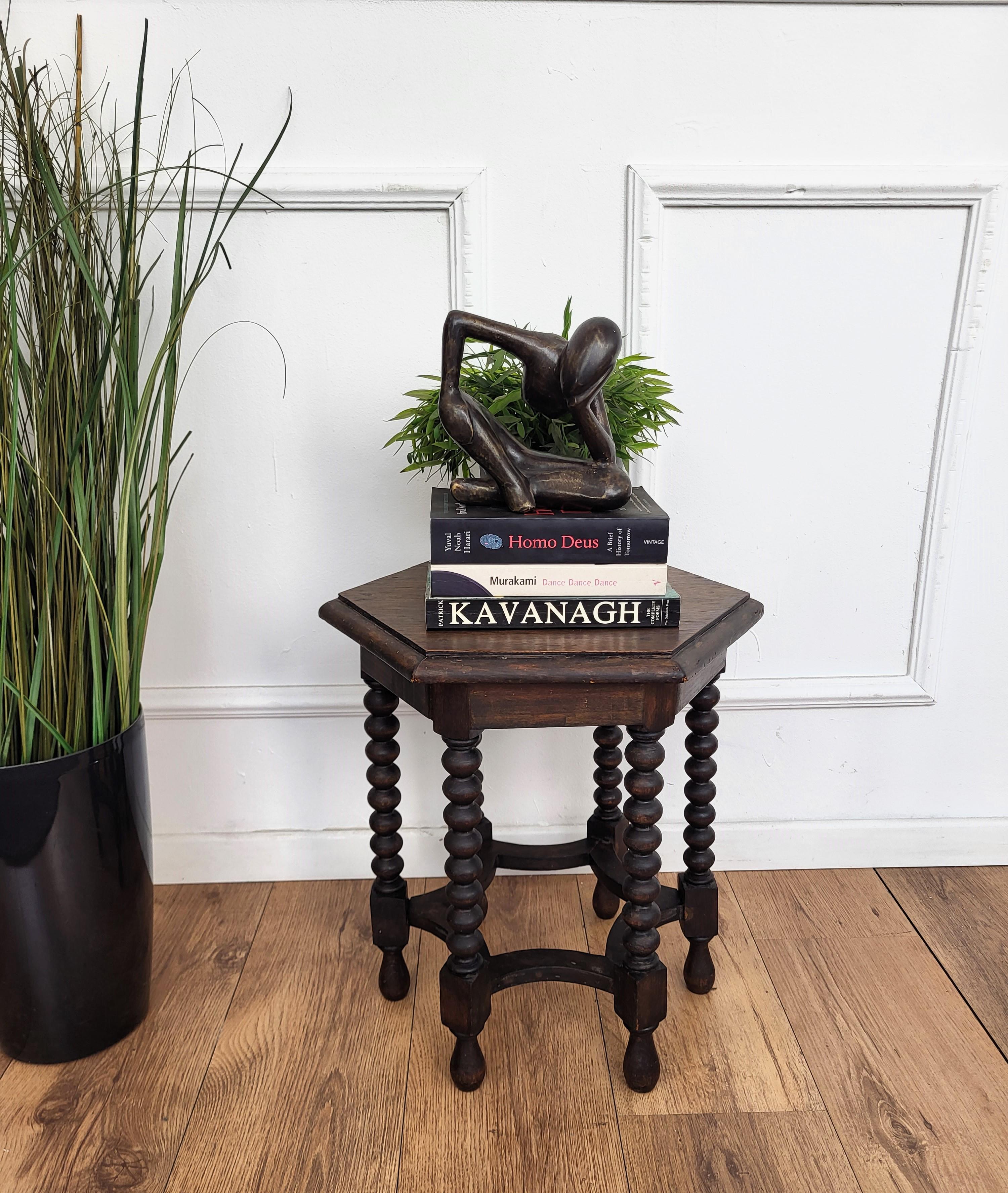 Beautiful antique Italian solid walnut side table or stool features hexagonal top with beveled edges over six beautifully bobbin turned legs, connected to one another with optogonal star shaped central stretcher. 
This Italian walnut stool or side