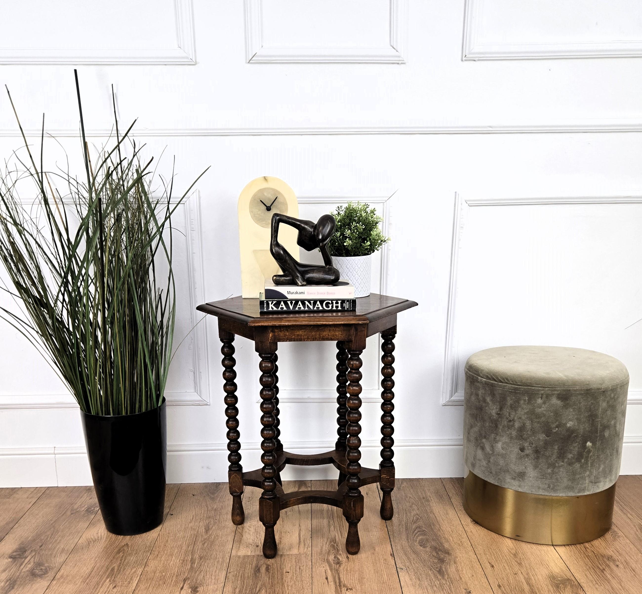 Beautiful antique Italian solid walnut side table, features hexagonal top with beveled edges over six beautifully bobbin turned legs, connected to one another with star shaped central stretcher. 
This Italian walnut side table or coffee table with