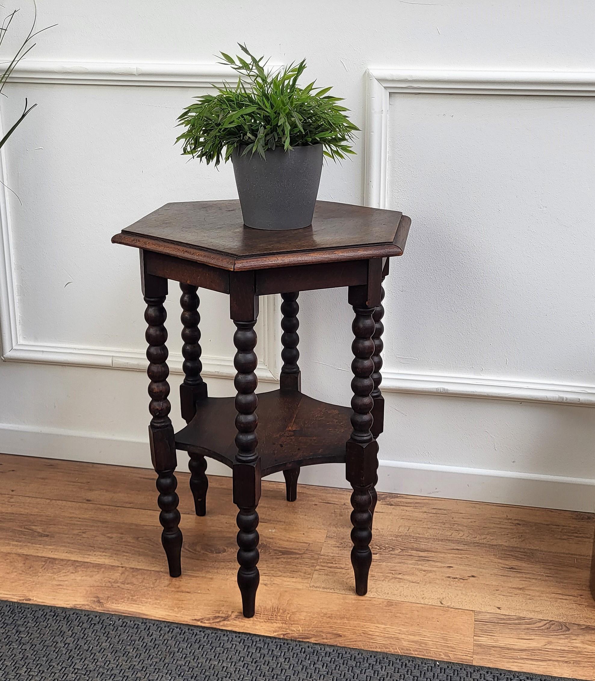 Beautiful antique Italian solid walnut side table or stool features hexagonal top with beveled edges over six beautifully bobbin turned barley twisted legs, connected to one another with central star shaped central stretcher.
 
This Italian walnut