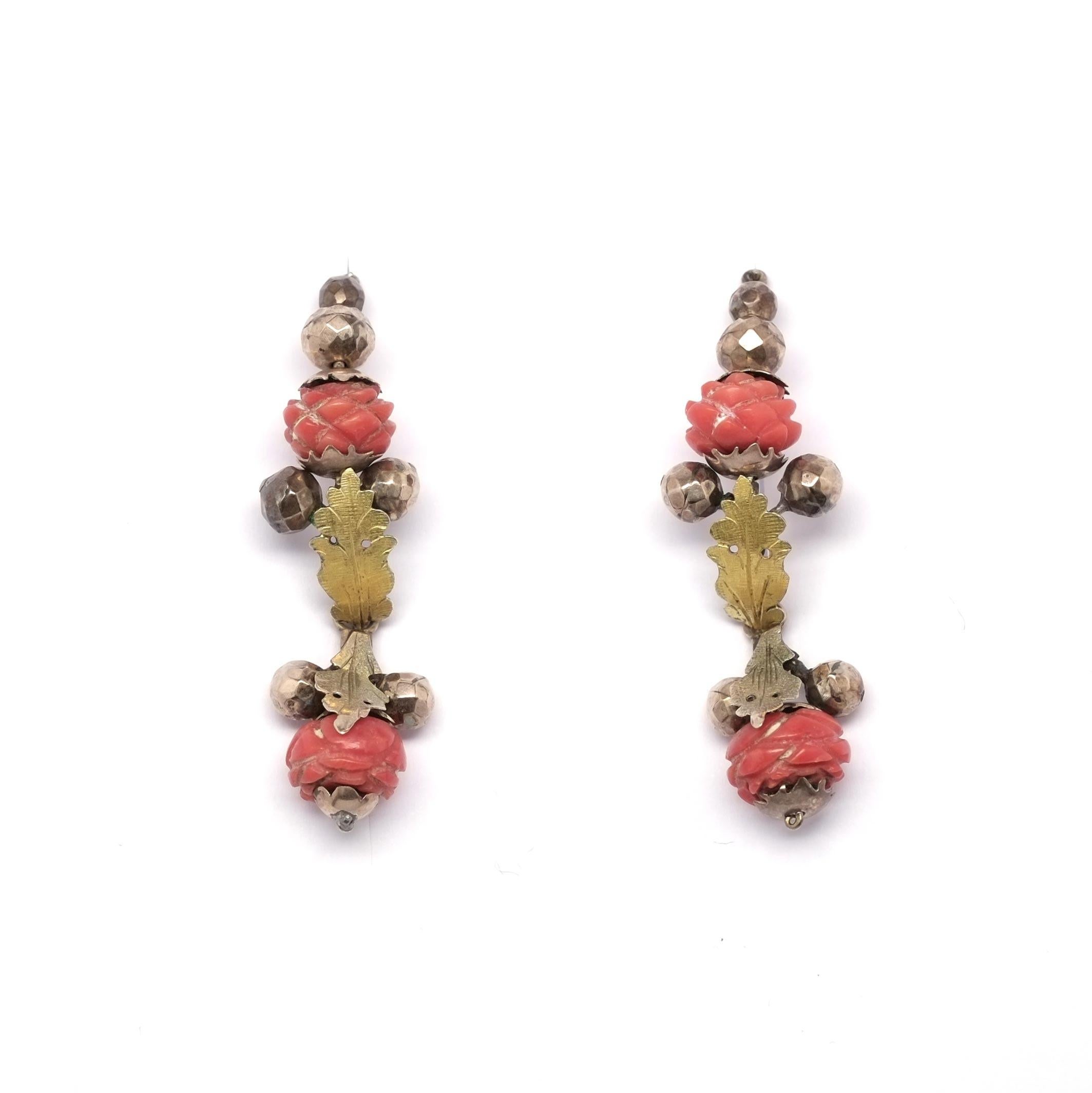 At some point during the first half of the 19th century these gorgeous gold earrings where handcrafted at the very north of Italy, Alto Adige. These gold earrings are set with natural coral spheres which are hand engraved according to tradition, the