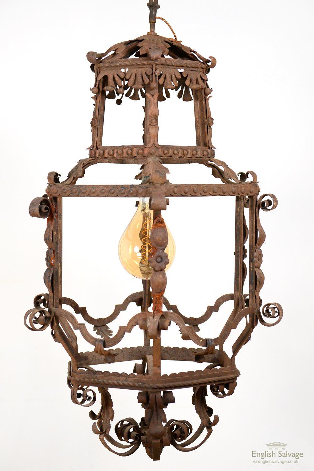 Stunning and very unusual hexagonal large Italian wrought iron lantern, dating from early 19th Century. Hexagonal in form with scrolling acanthus detail, rope and floral details. Surface rust and a lovely patina, evidence of its great age. Newly