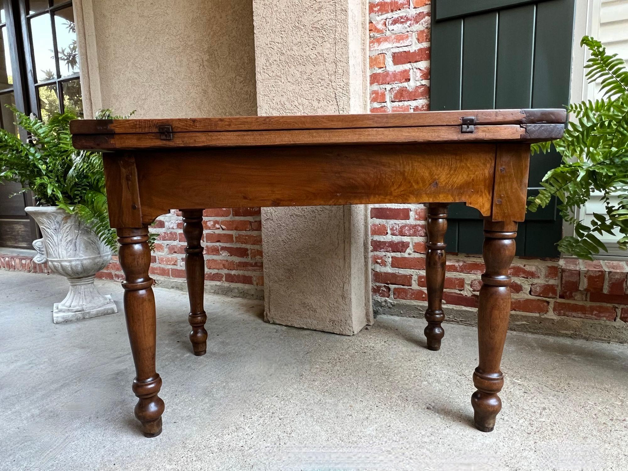 Antique Italian Kitchen Farm Table Island Walnut Flip Top Game Table circa1800.

Direct from Italy, an extraordinary antique “flip top” table, that was likely originally used as a baker or kitchen table/island. Solid walnut, stunning aged patina,