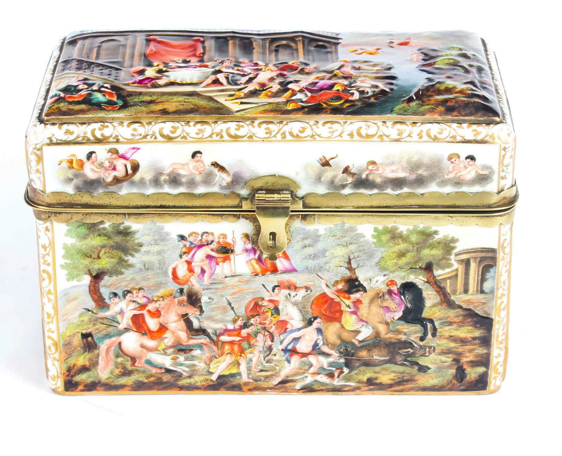 This is a beautiful antique large Italian Capodimonte porcelain table casket, 1880 in date. 

It features a gladiatorial scene with the Emperor and Empress on the lid, the sides are lavishly decorated with playful putti and hunting scenes, and it