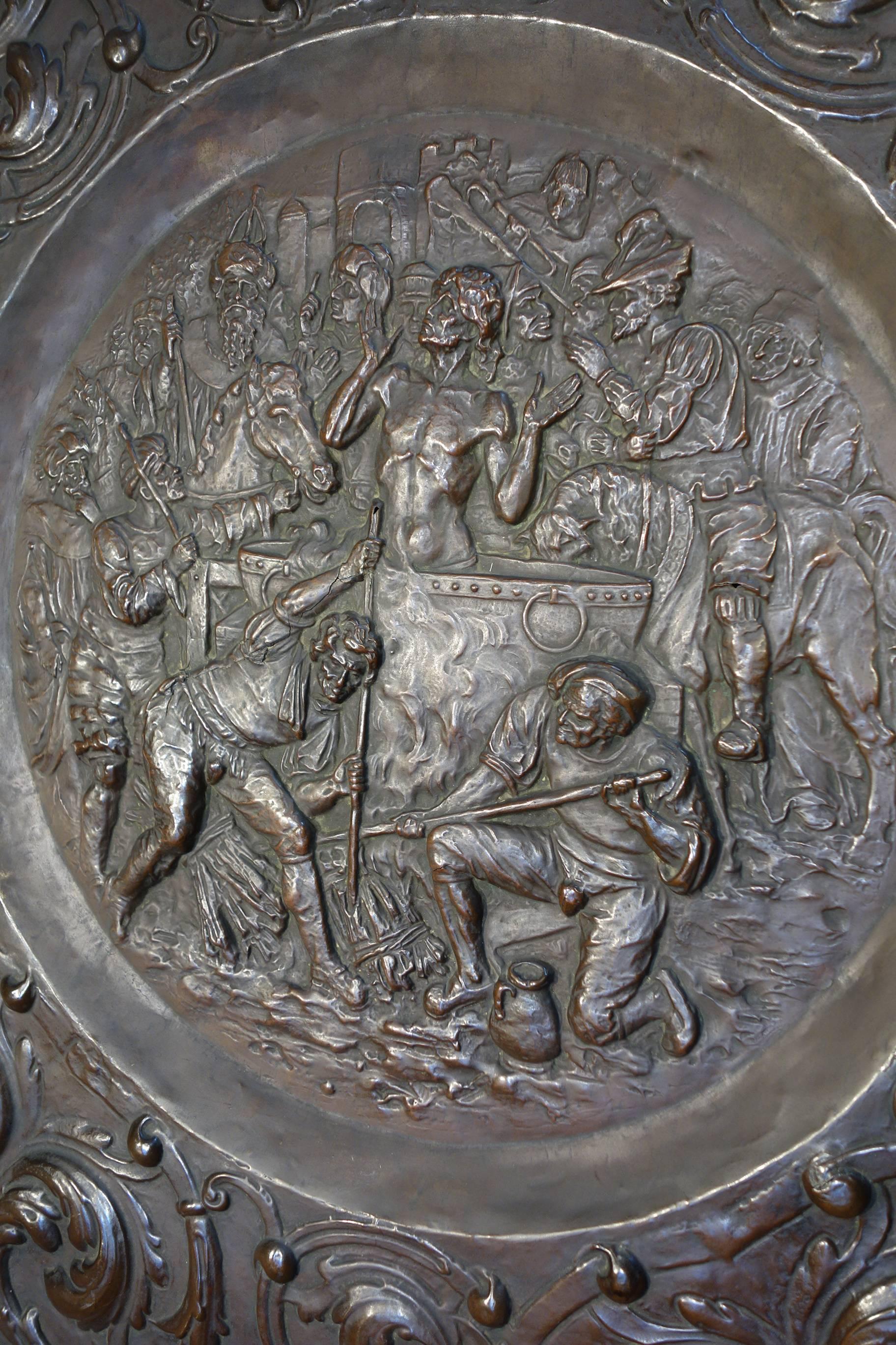 Symbolic and decorative Renaissance Style embossed copper wall medallion, dark patina. A king on horseback and a trumpeter on horseback are present, perhaps to herald the baptism of a saint. Striking detail and size.

Measures: 36.3