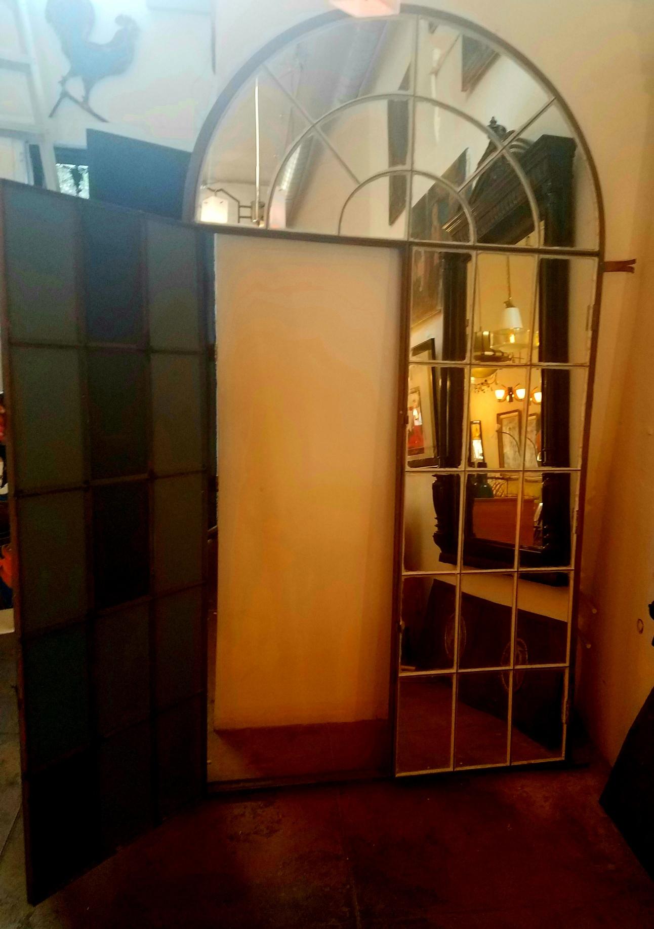 Venetian very large mirror. Frame has been transformed from the early 1900s veranda window-door made by black smith. The mirror frame will be a great addition to antique, Industrial, or contemporary setting.
Inside door open measurement H: 65 W: