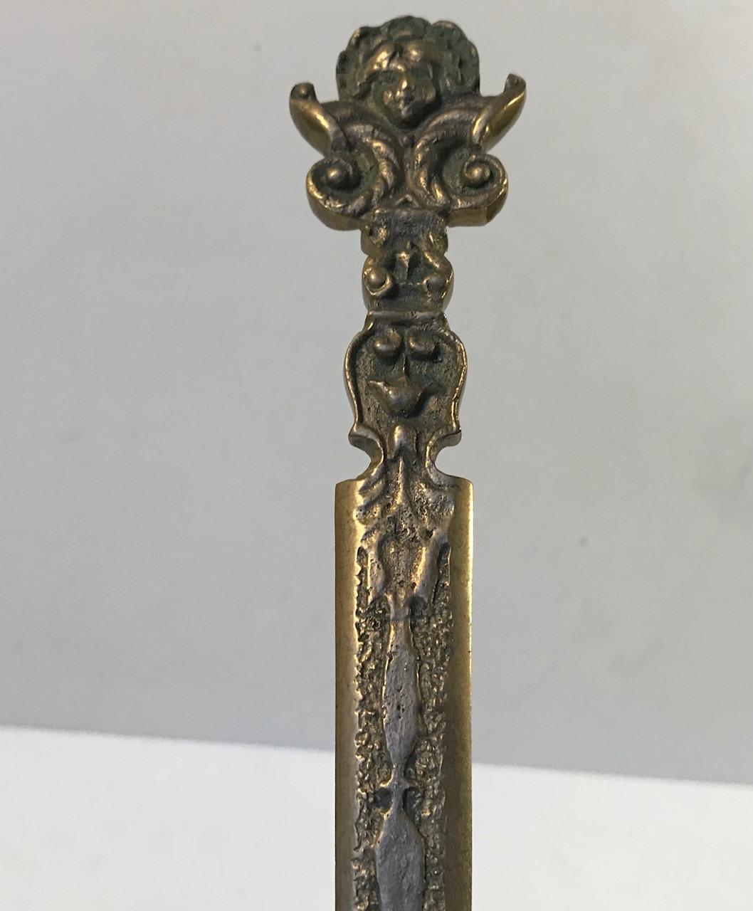 Italian revival piece of earlier presumably 16th or 17th century letter opener. Made from cast brass and it has some weight to it.