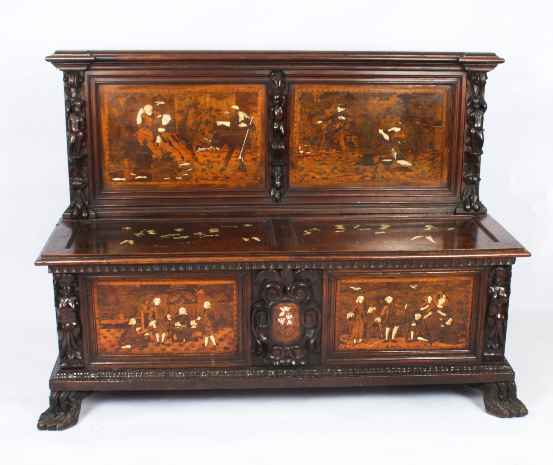 This is a wonderful antique Italian Renaissance Revival walnut, specimen wood and marquetry decorated cassapanca or hall bench, made in Lombardy Italy and Circa 1780 in date.
 
It is smothered in the most wonderful carved panels with fabulous inlaid