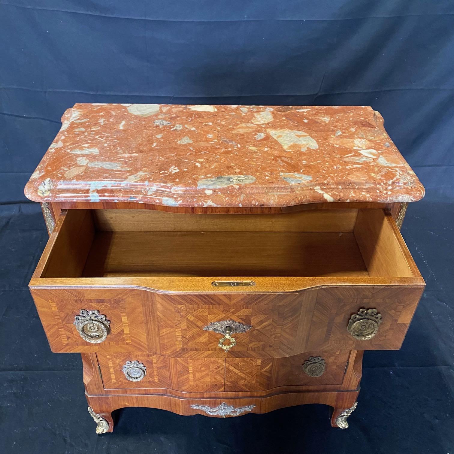 Classic Louis XV style beautifully inlaid Italian marble top cabinet, chest, commode or media cabinet having one large drawer over two faux drawers that open as doors; perfect for disguising media, or can simply use as a versatile storage chest.