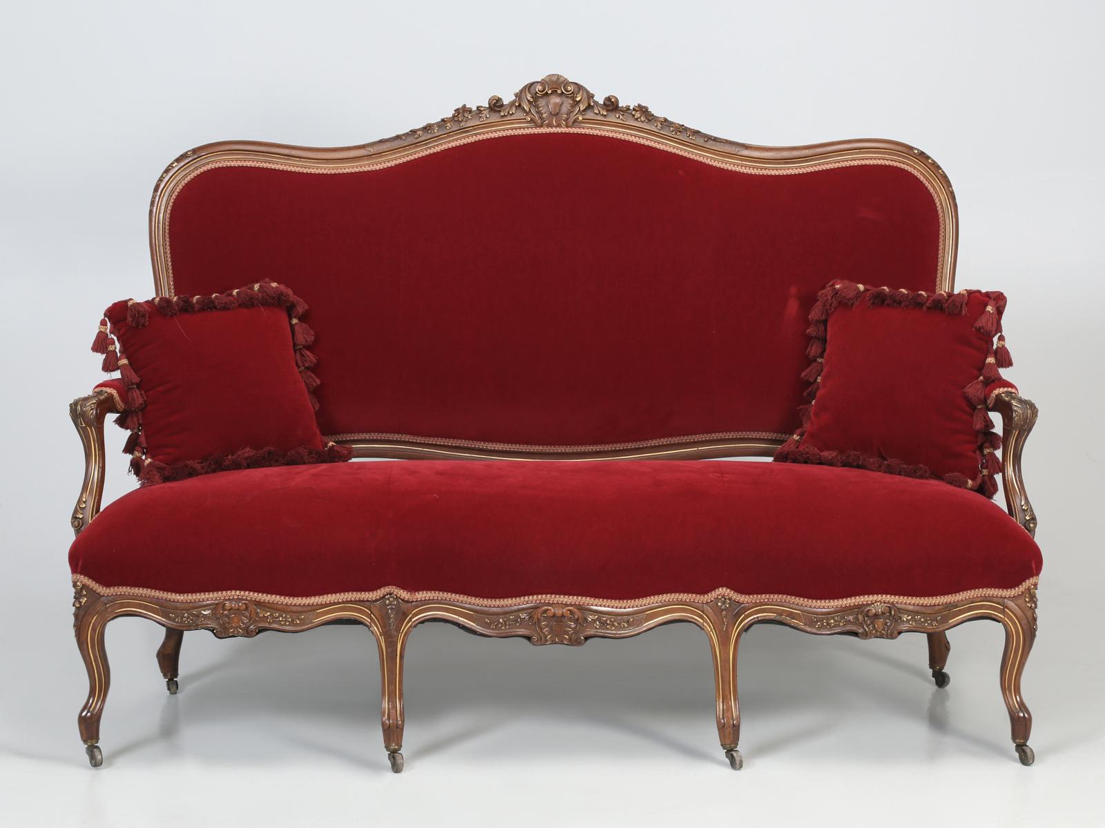 Antique Italian Louis XV style settee that we just received from an Italian parlor suite that included, antique Italian arm chairs, side chairs, tables etc. Fabric covering on this antique Italian settee is a high-quality mohair and there is no hint