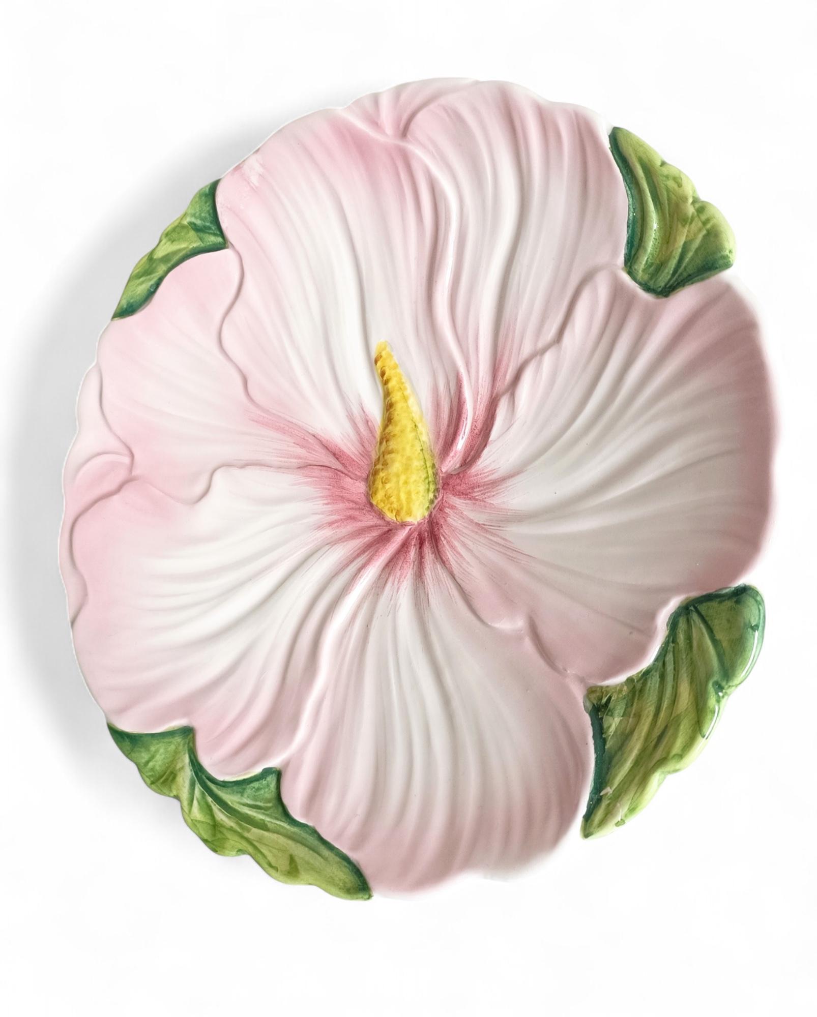 Italian Art Nouveau Majolica Hibiscus Plate, Early 20th Century

A handmade Italian majolica plate featuring a detailed hibiscus flower in shades of pink, white, green, and yellow. Crafted in the early 20th century in the Art Nouveau style. Marked